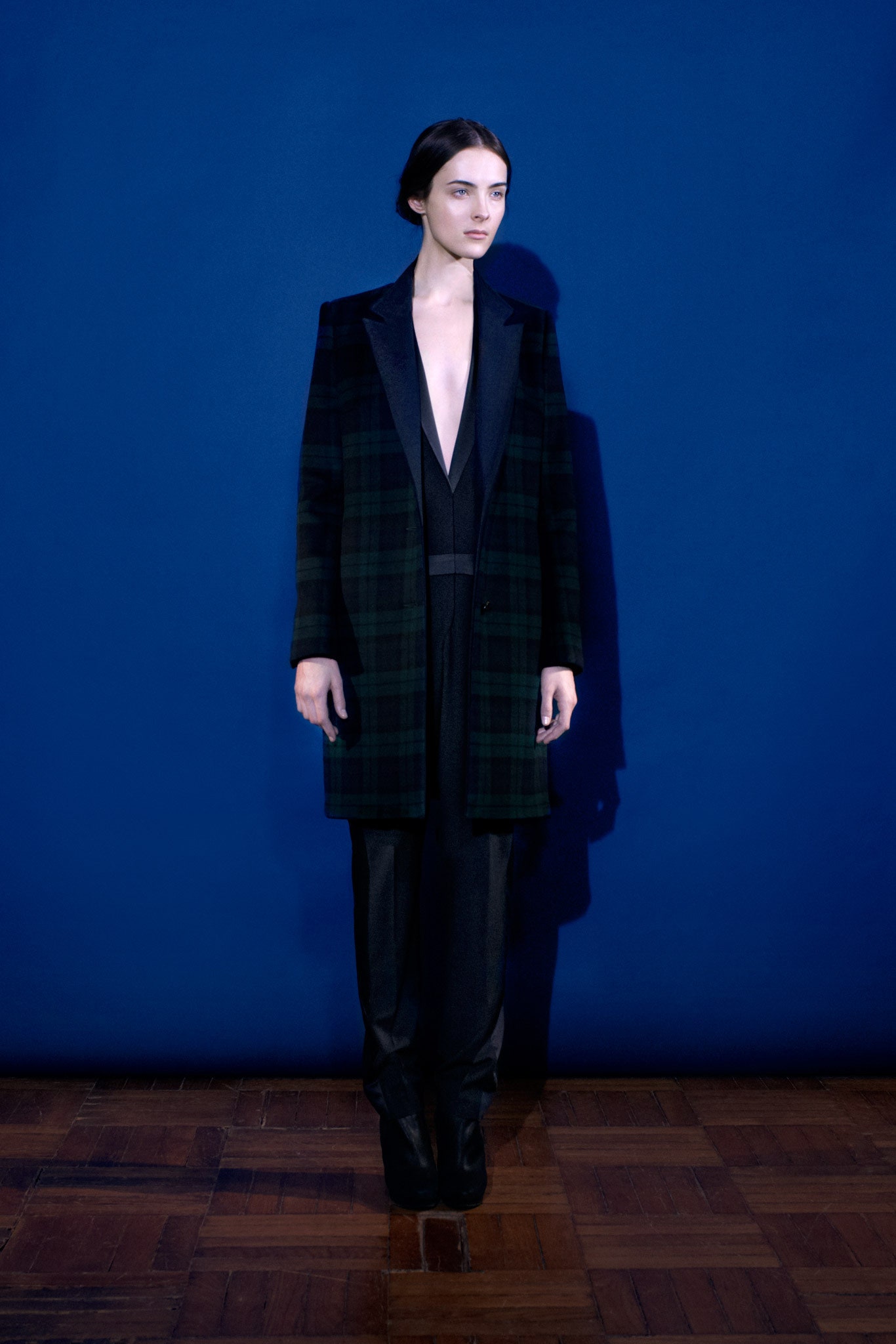 black and green plaid coat with tailored pants