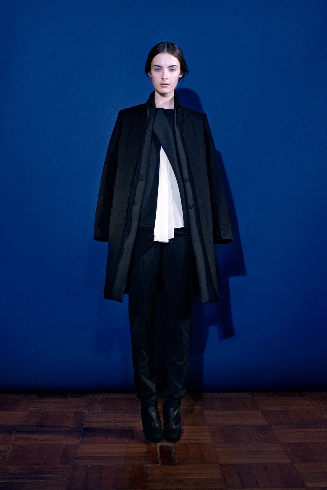 black wool long-sleeve collared relaxed buttoned coat