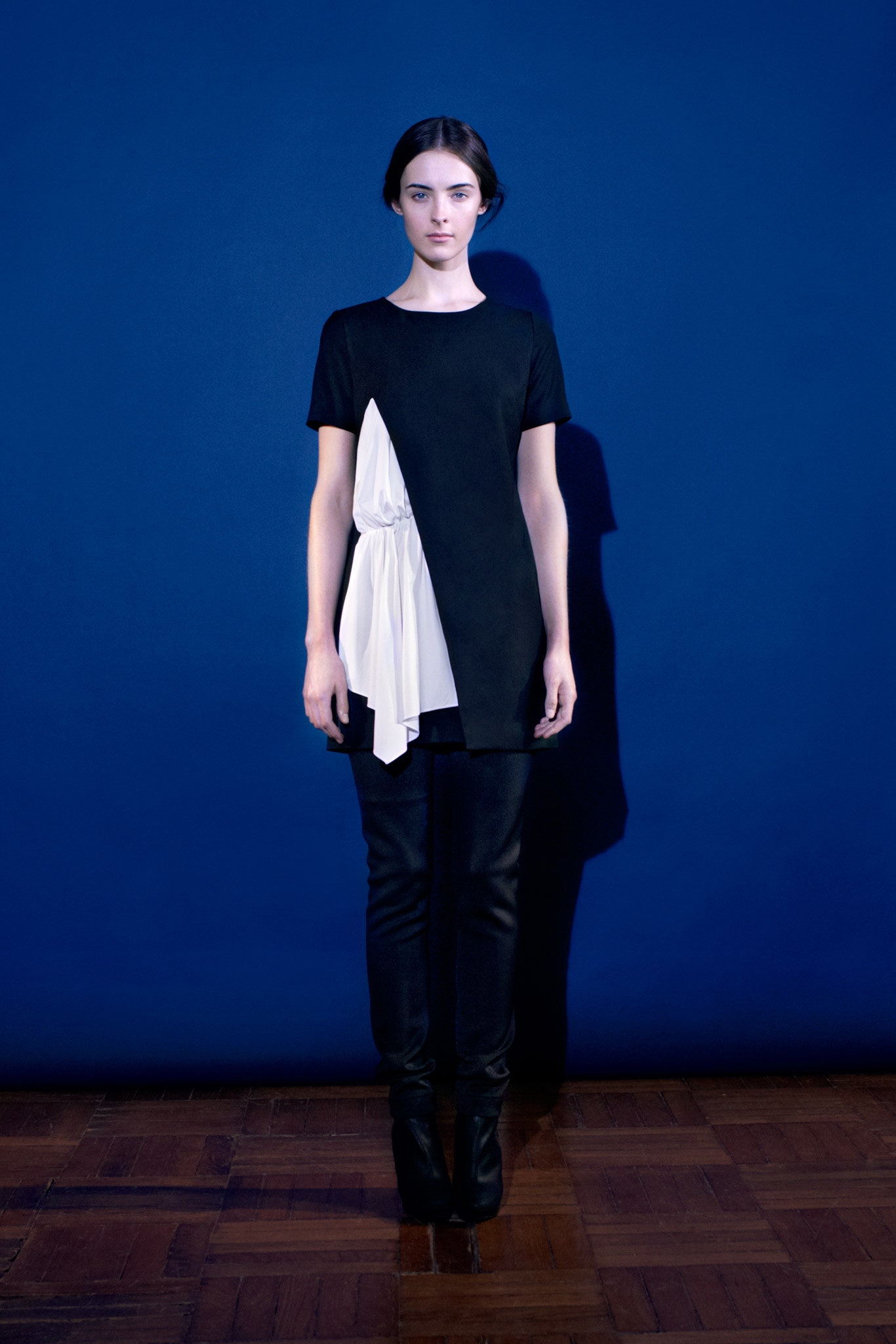 black short-sleeve asymmetric fitted draped top