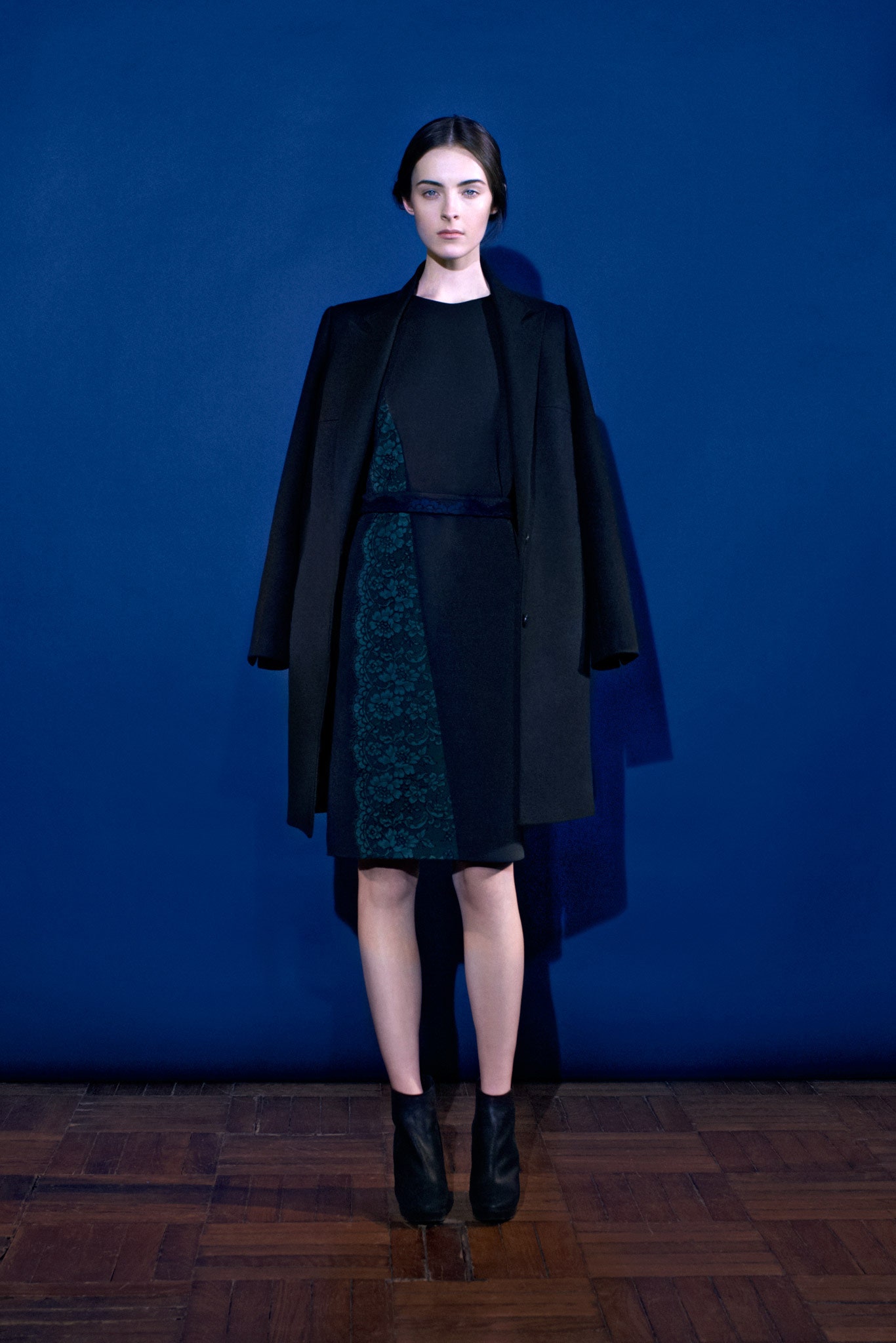 black wool long-sleeve collared relaxed buttoned coat