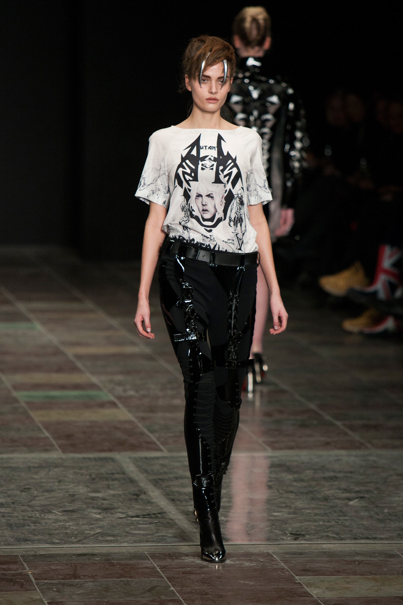 fitted white t-shirt and black vinyl pants