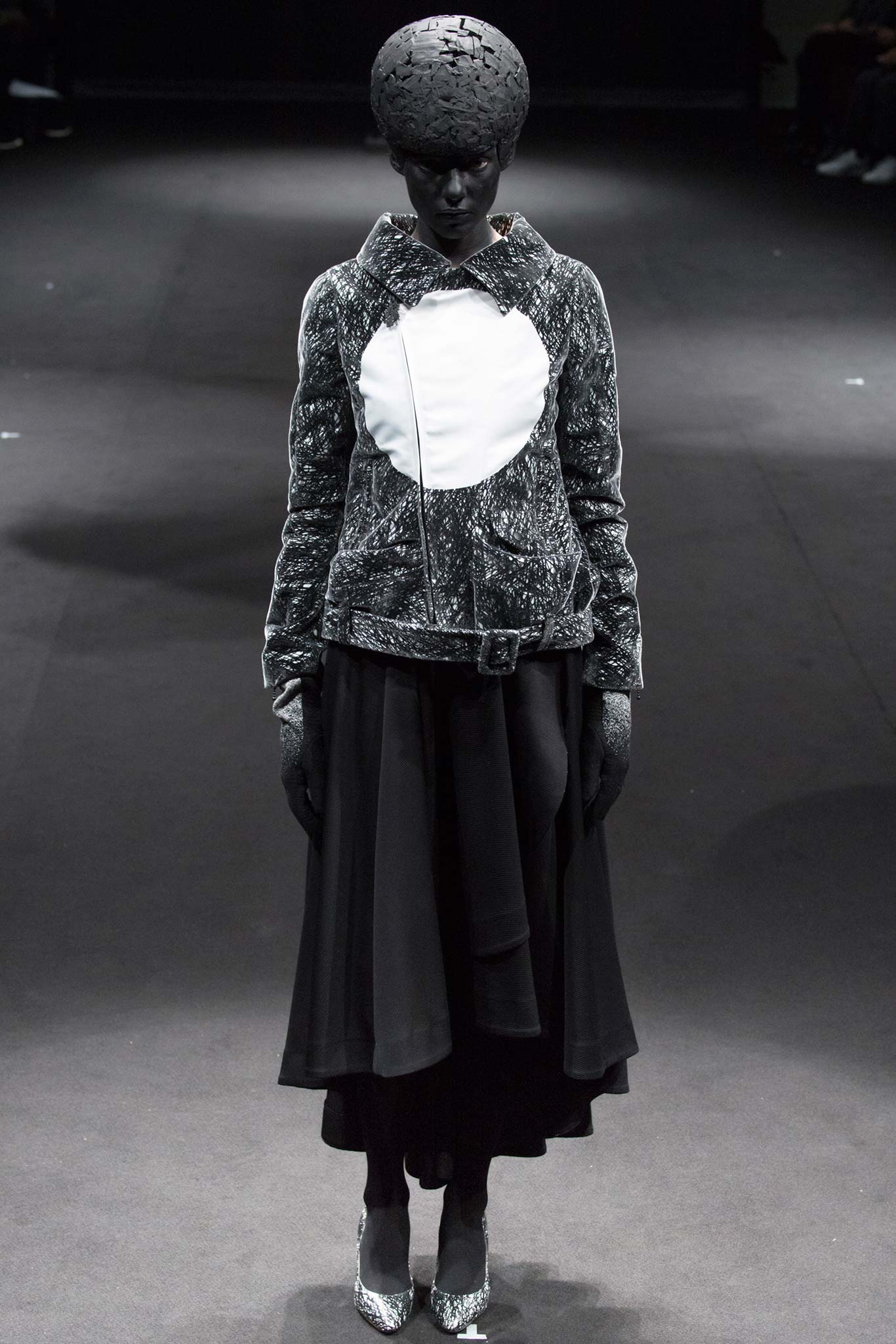 black and white fitted jacket with flared skirt
