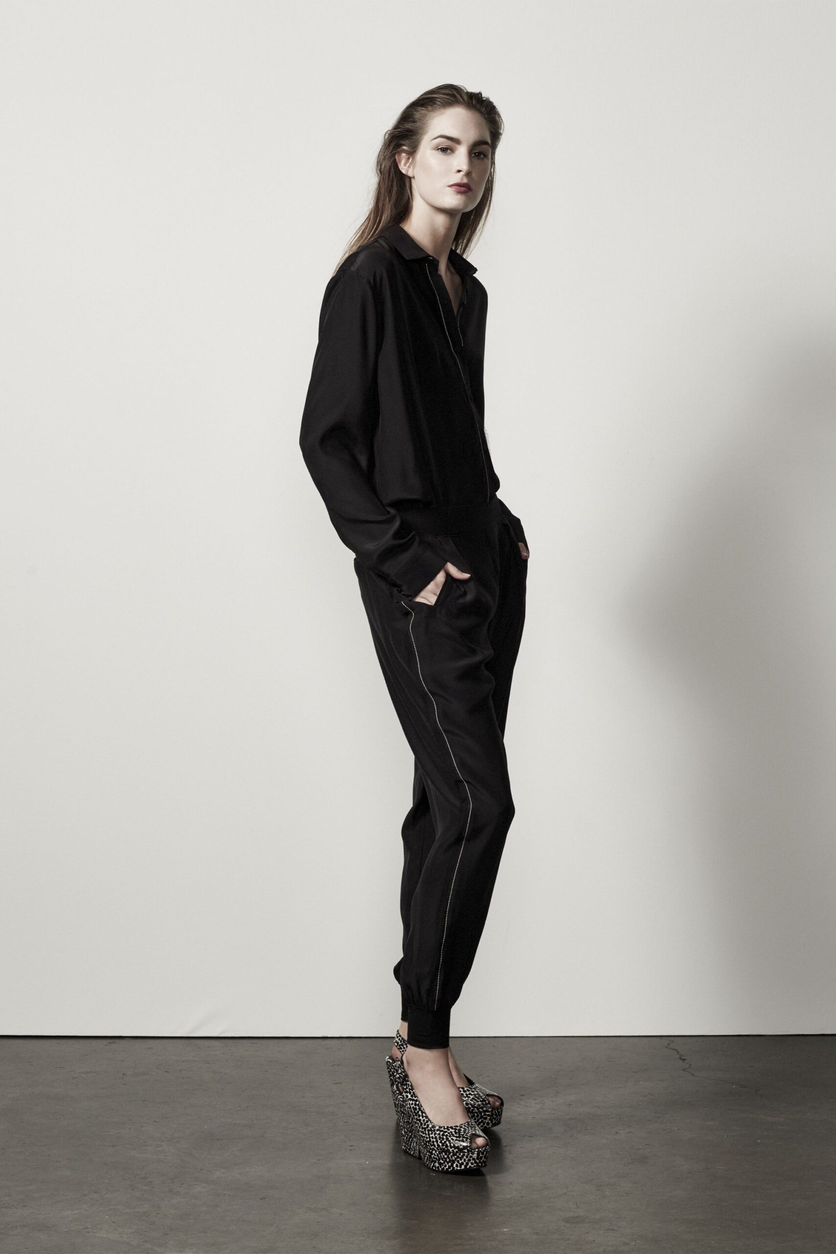 black relaxed jumpsuit with platform shoes