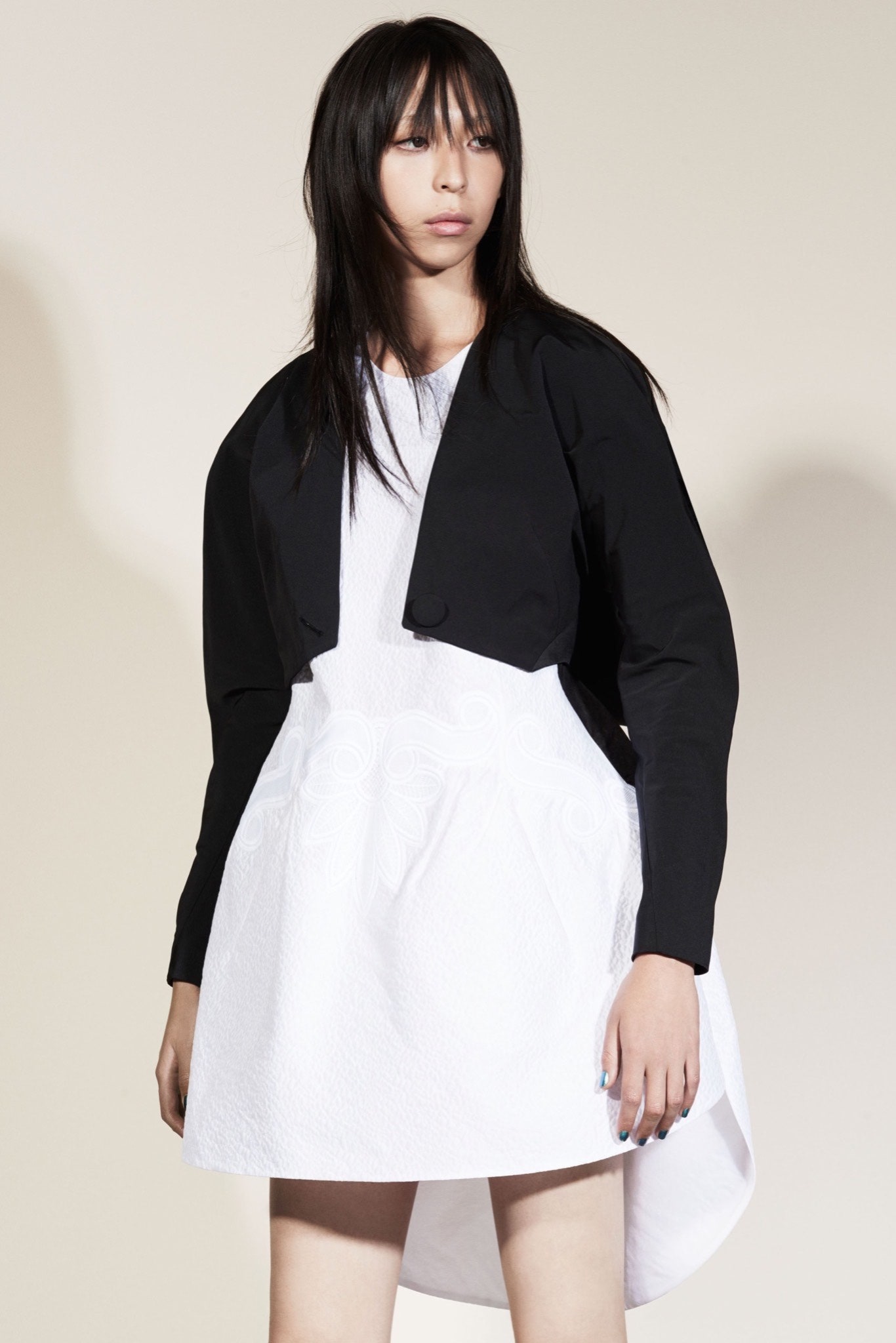 white mini dress with black jacket