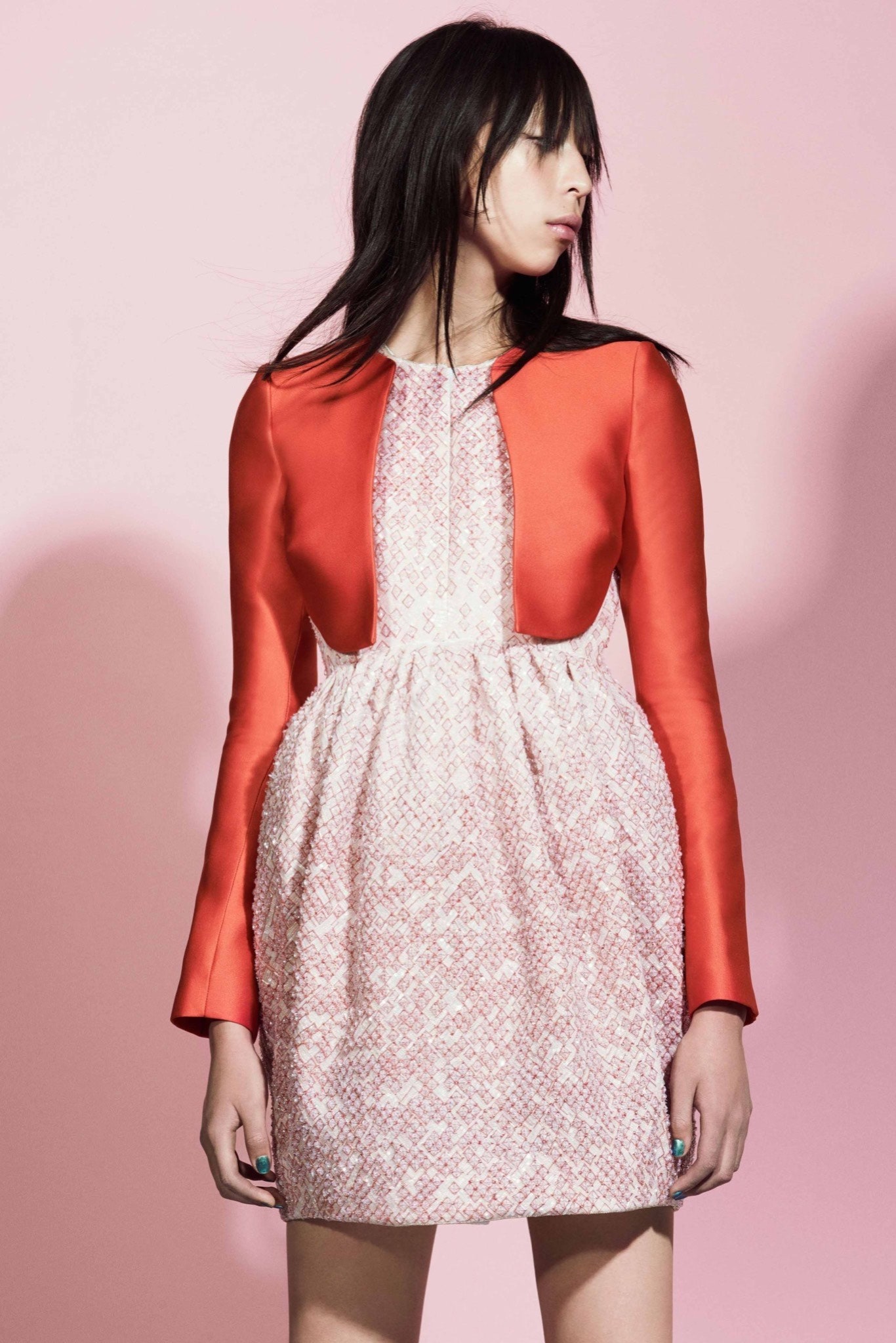 pink pleated mini dress with red jacket