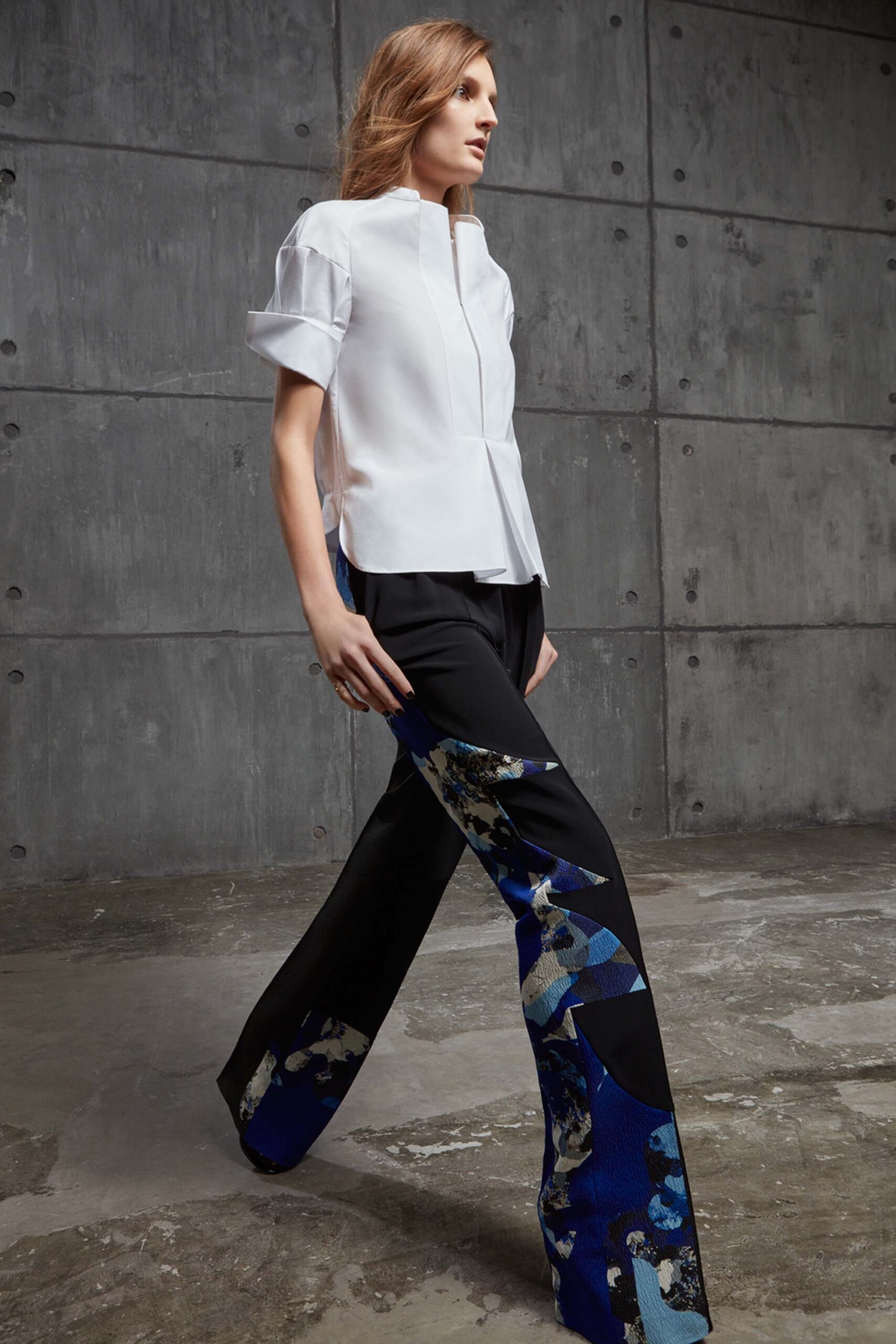 white fitted top with black blue pants