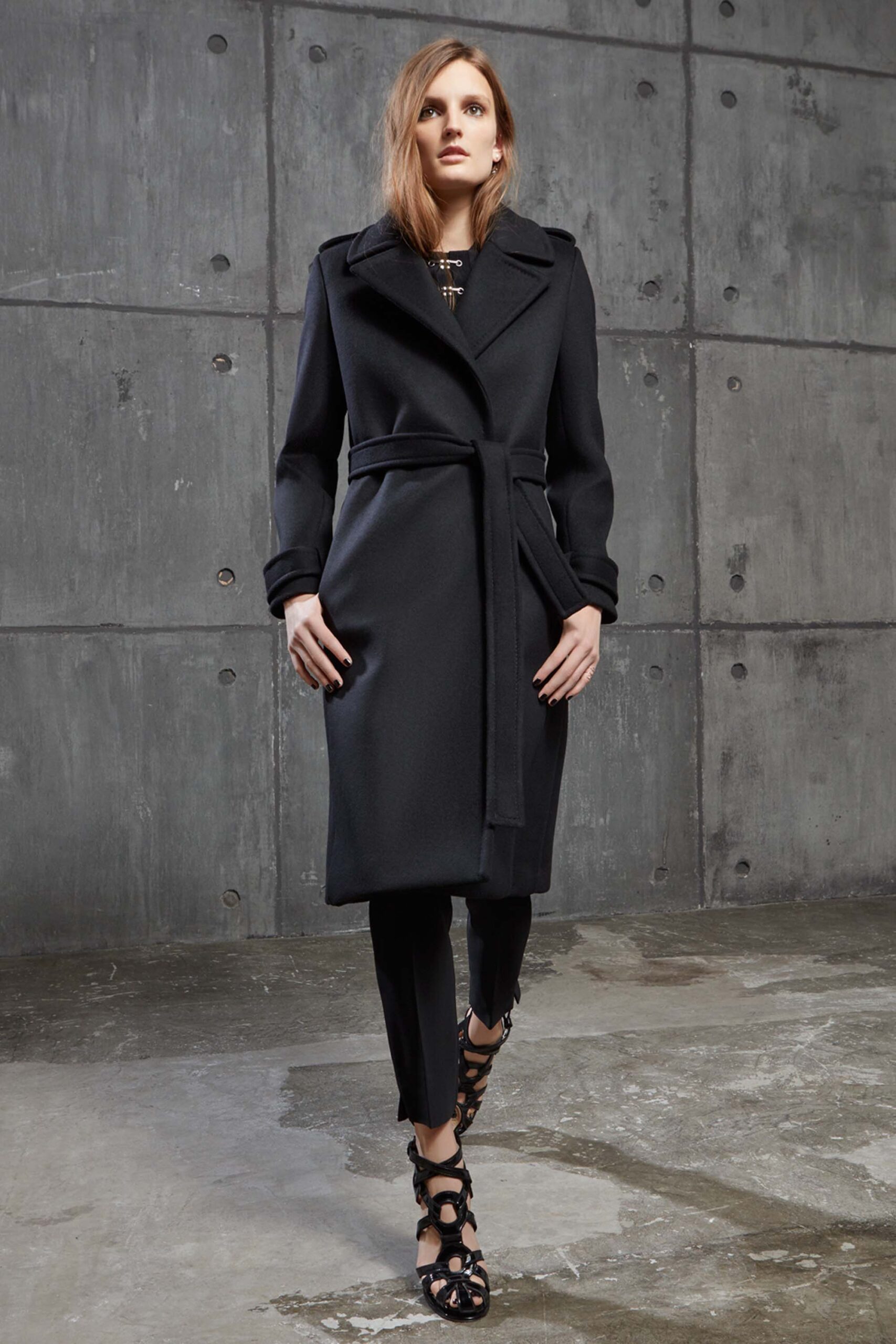 black fitted coat with slim pants