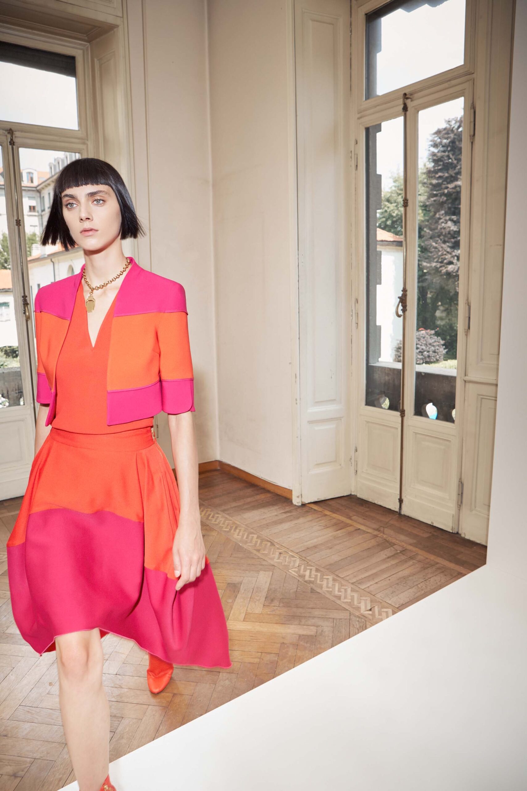 color-blocked pink and orange dress and jacket