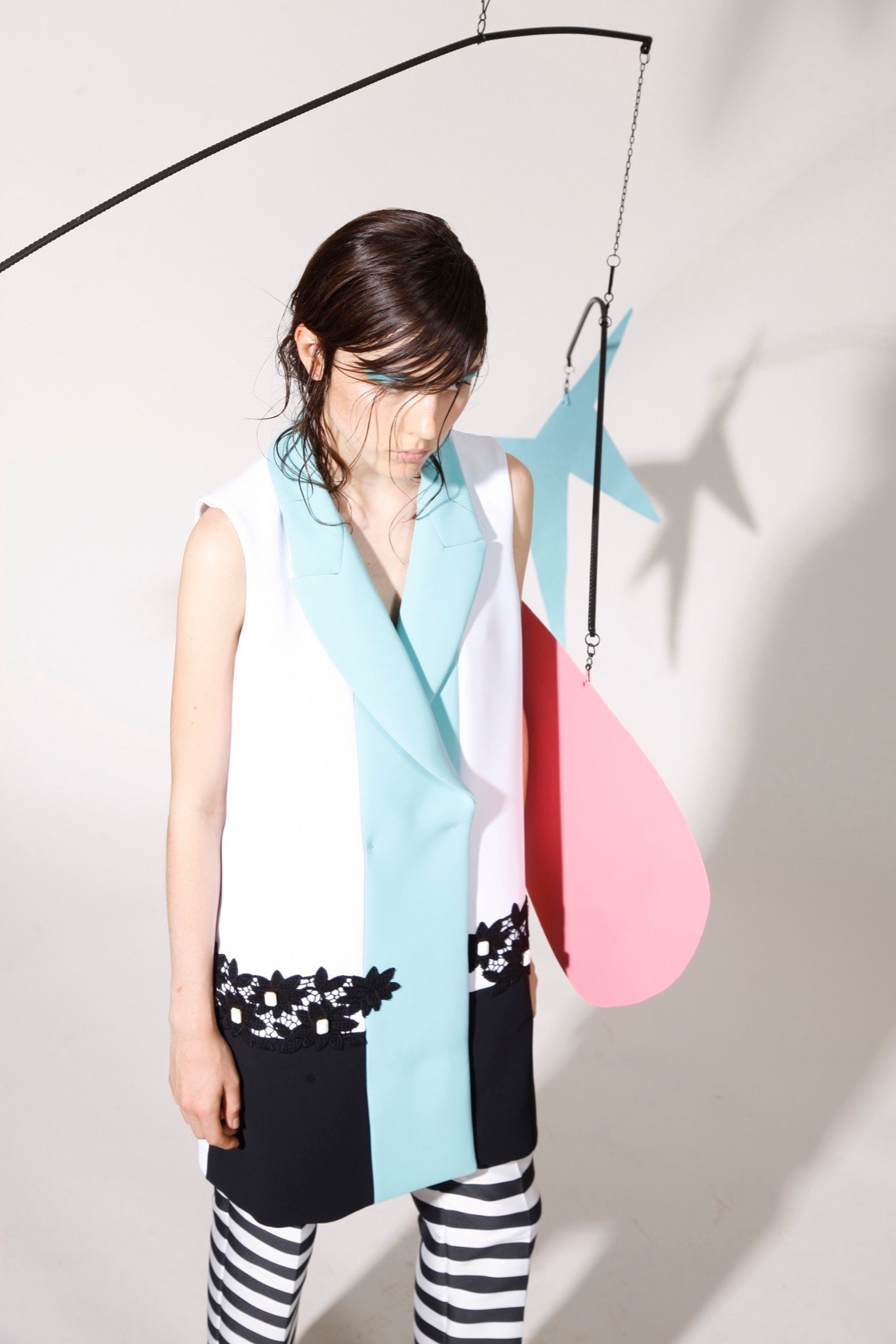 color-blocked sleeveless blazer and striped pants