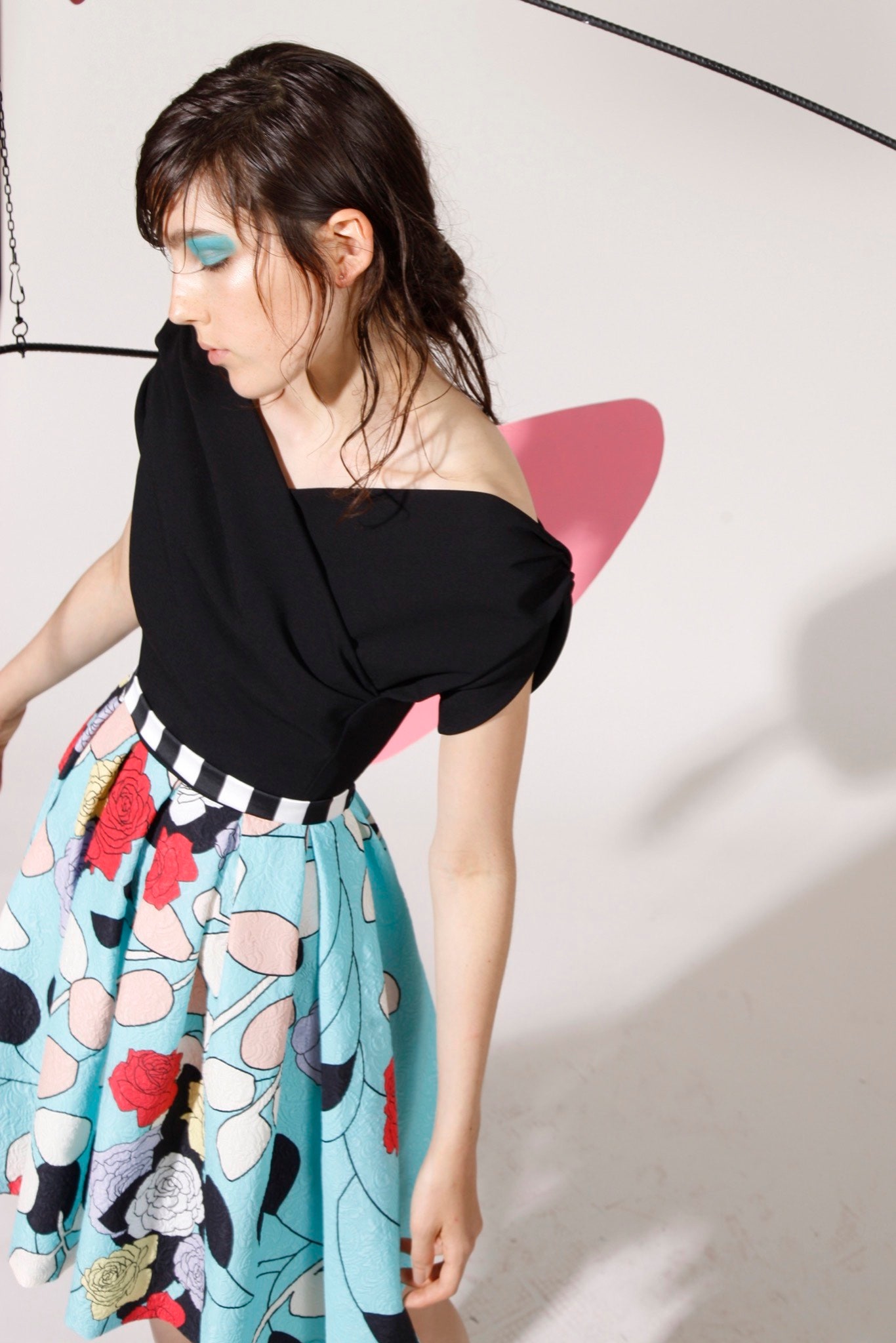 black off-shoulder top with printed skirt