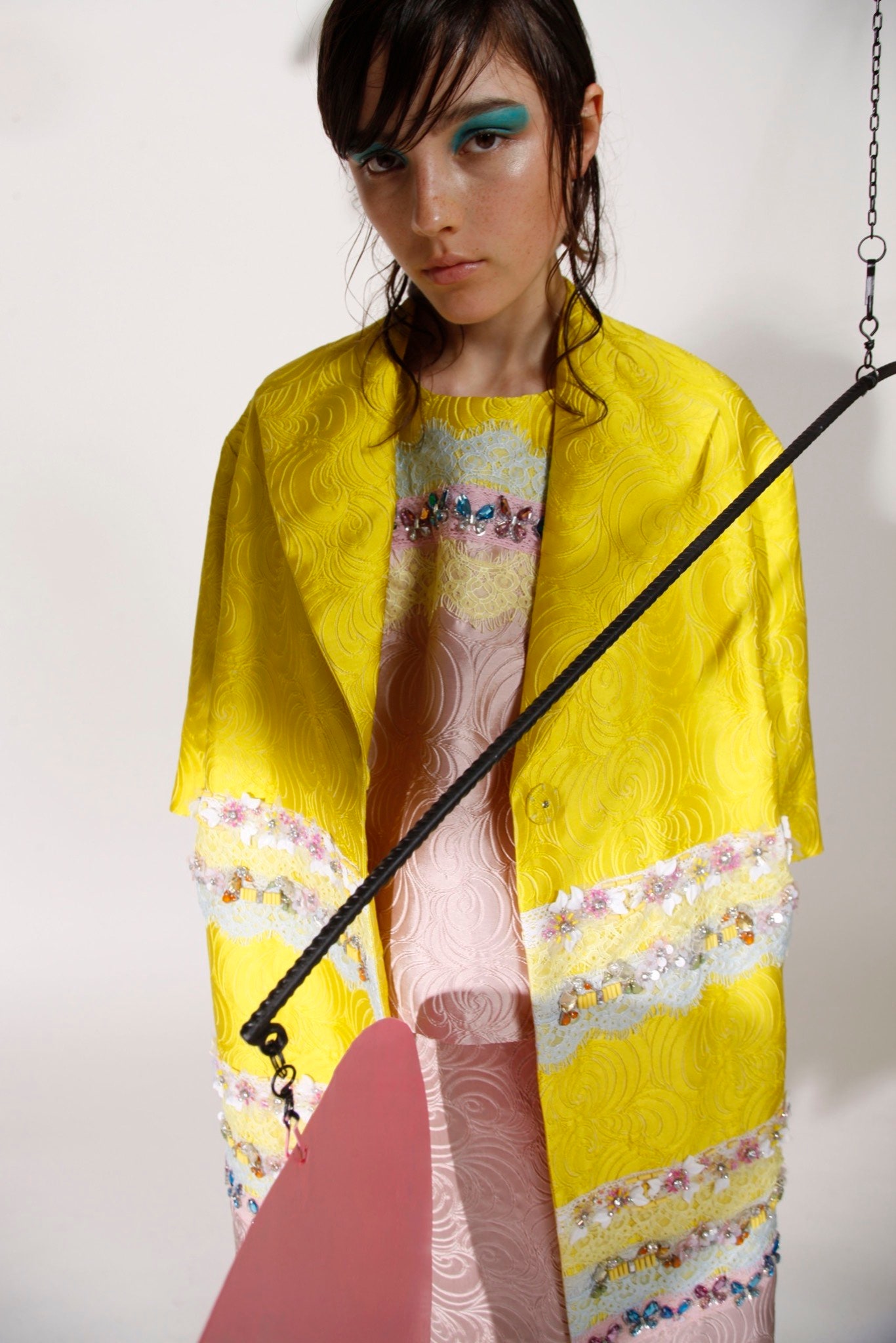 yellow coat and pink dress