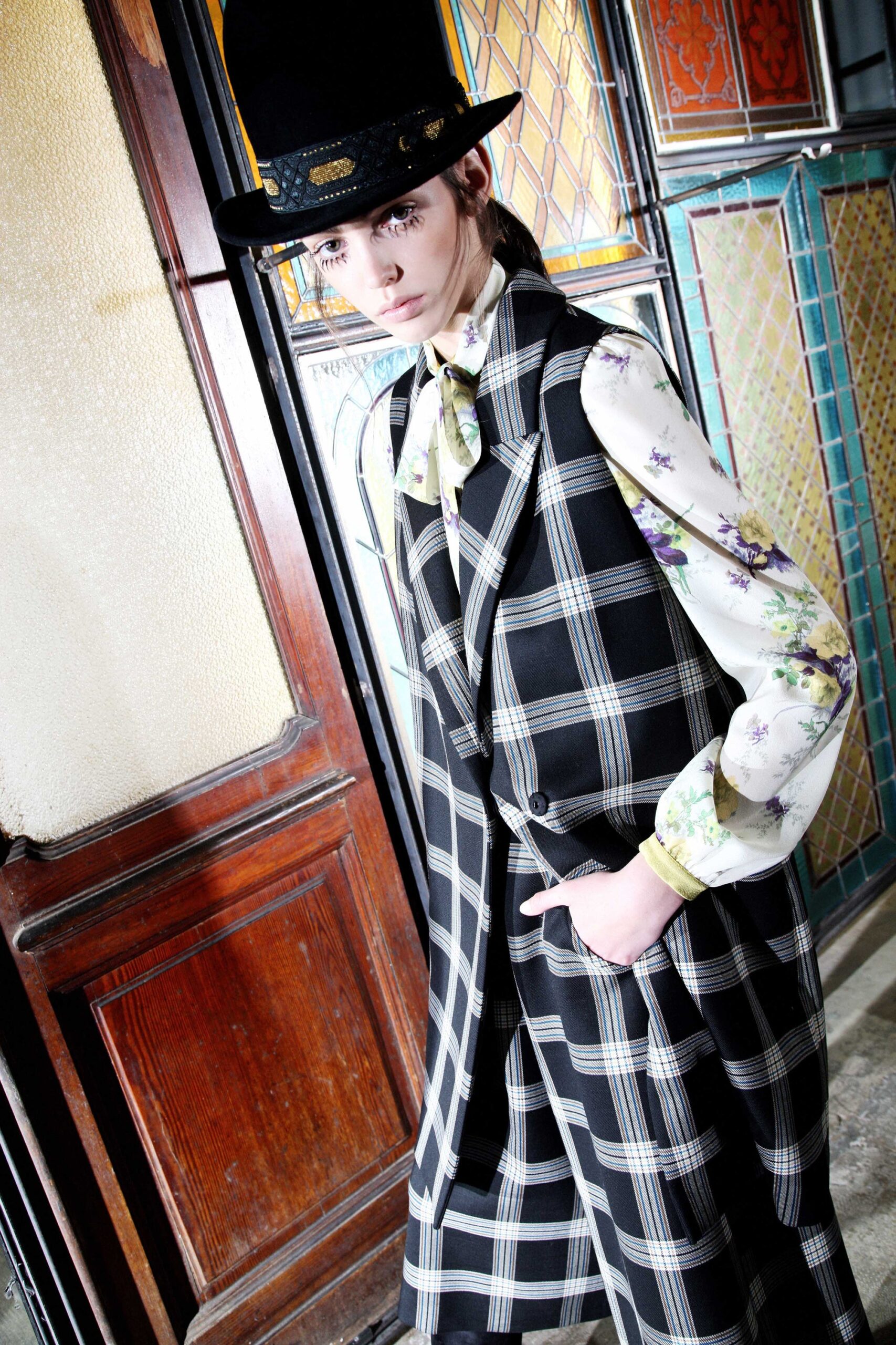 checked vest with floral blouse