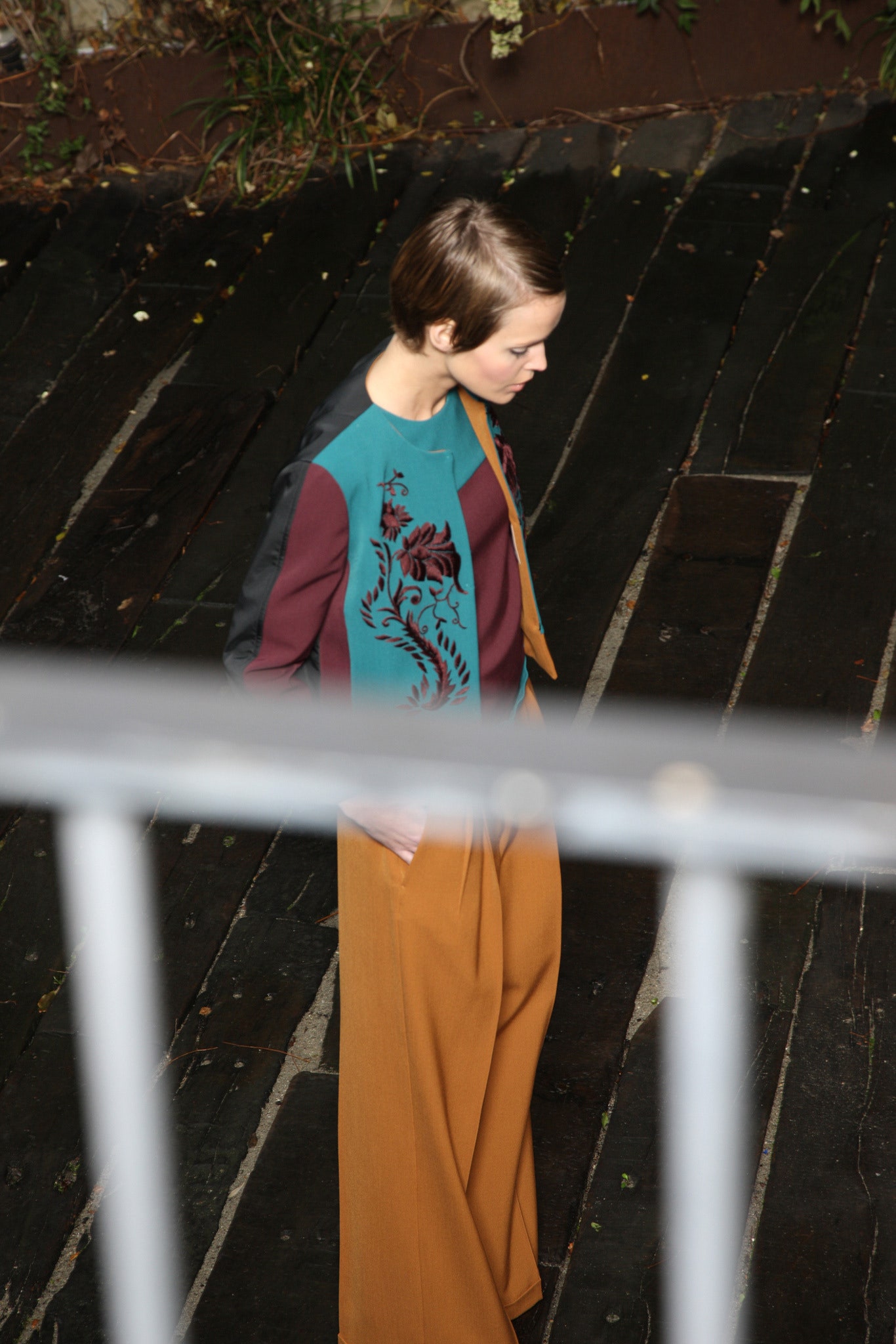 teal embroidered blazer with brown pants