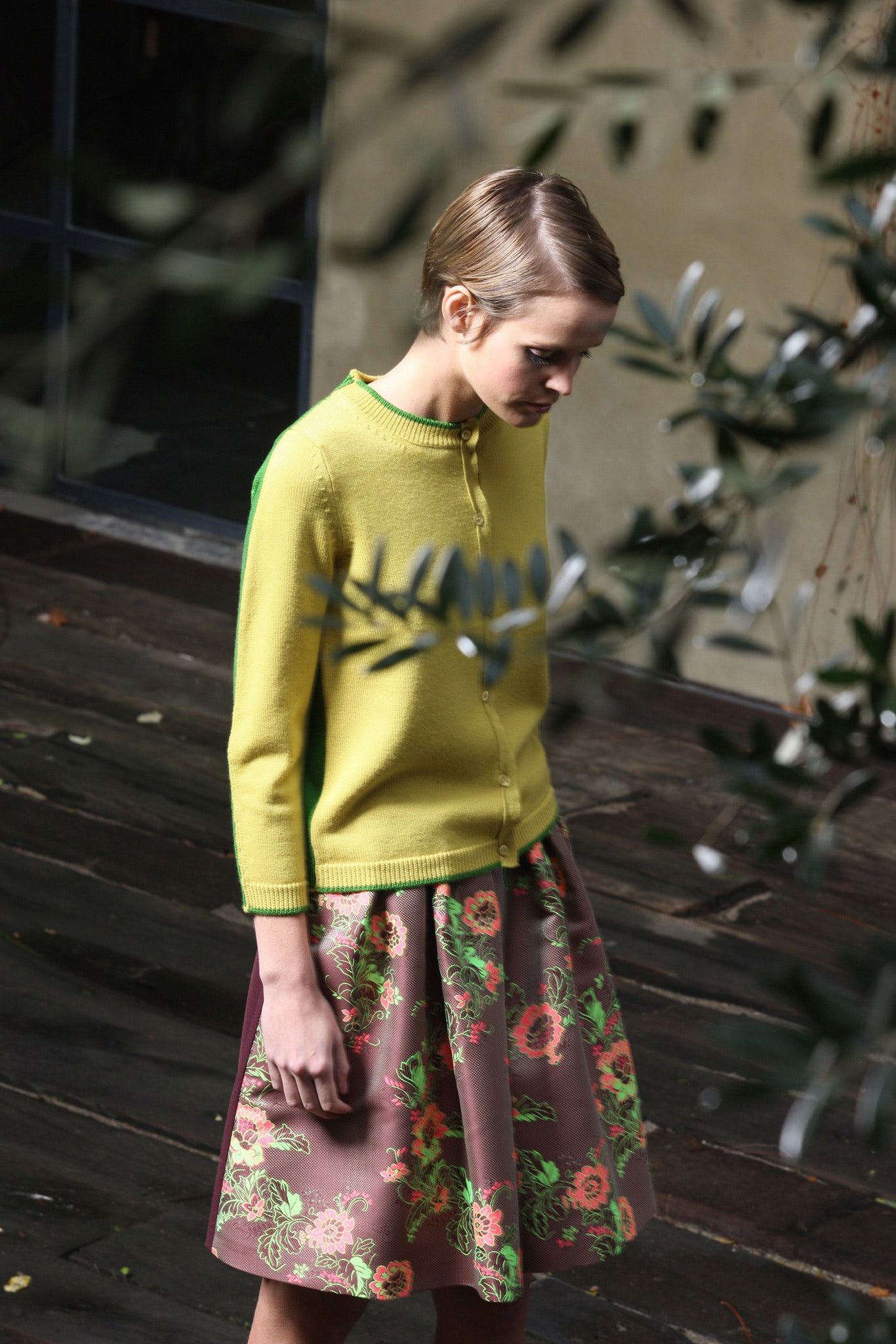 yellow cardigan and brown flared skirt