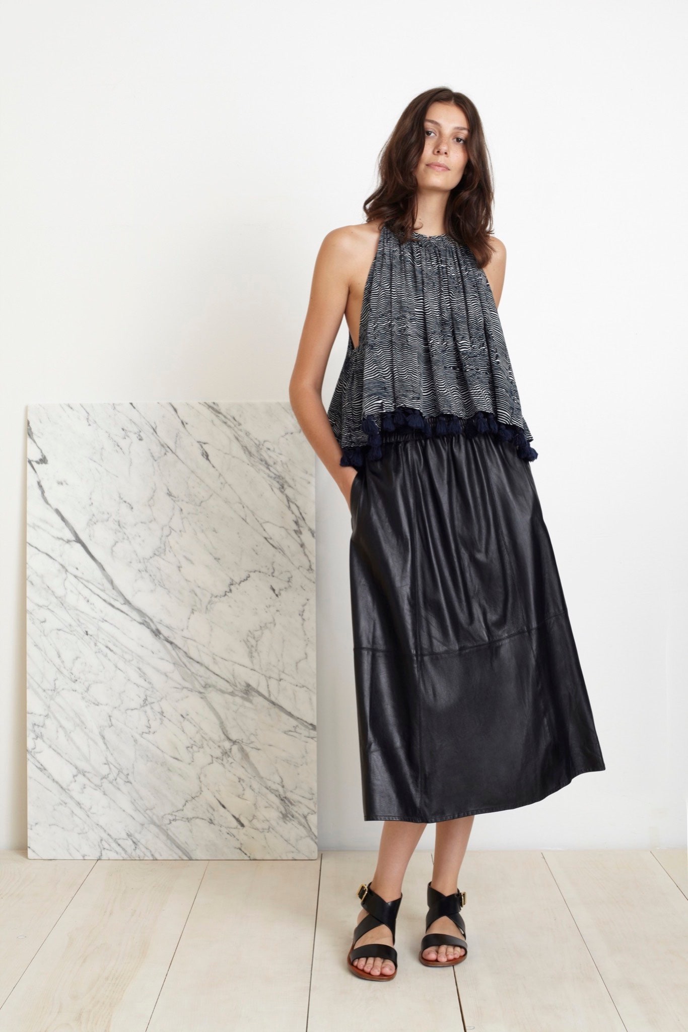 blue pleated top black leather skirt