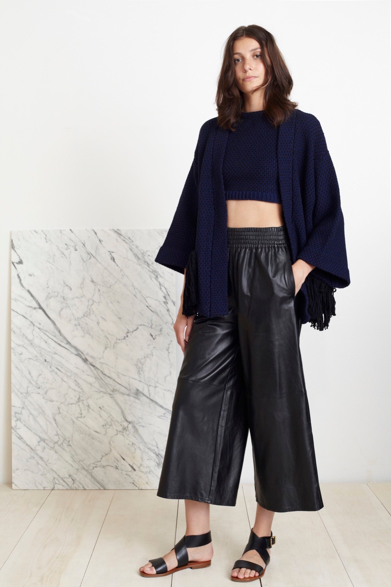 navy top black leather pants