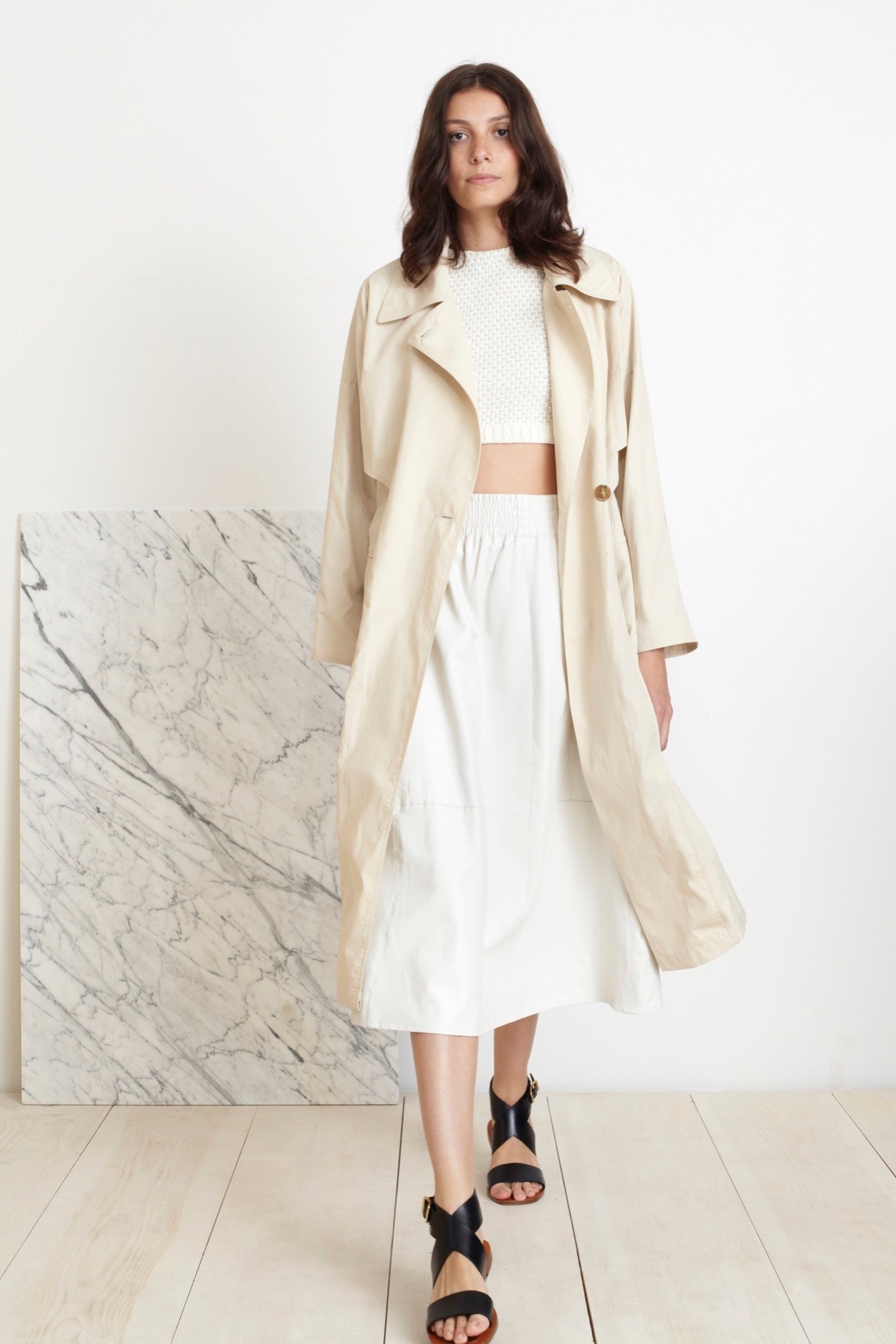 beige trench coat with white top