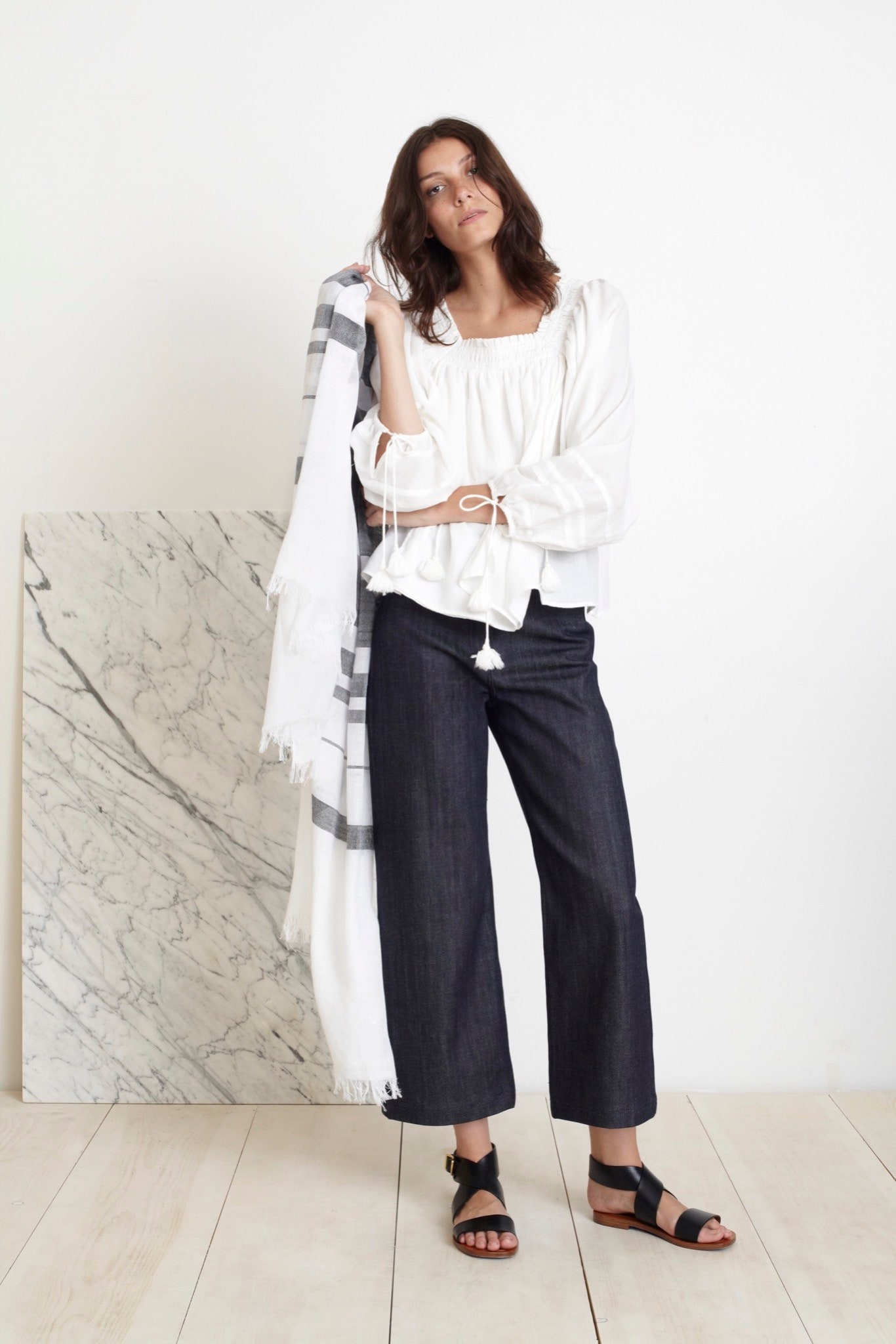 white relaxed blouse with blue pants