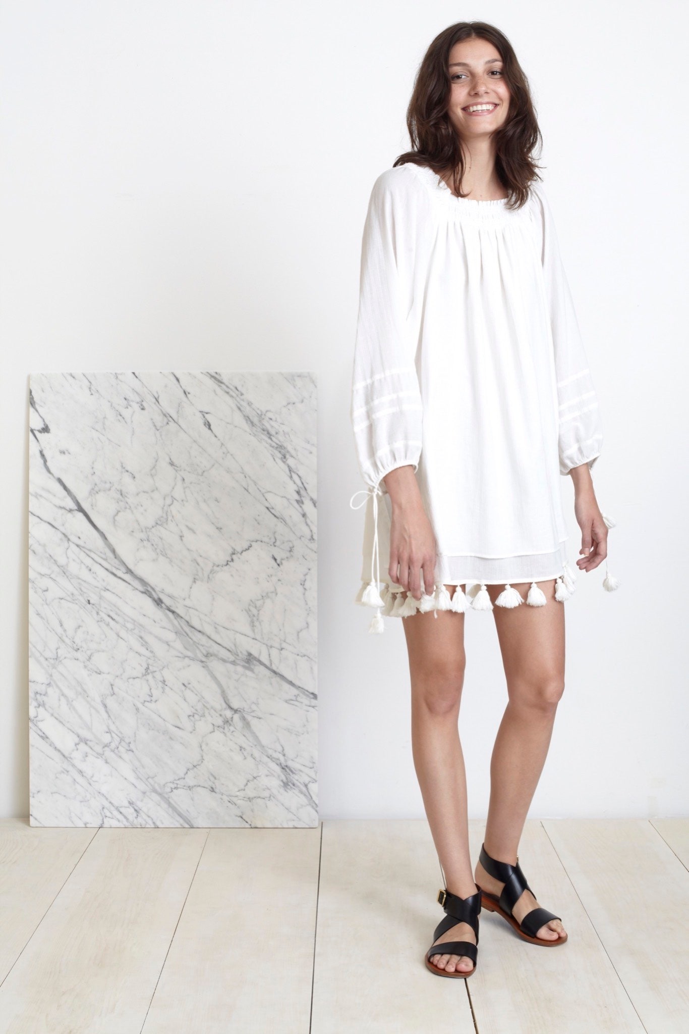 white relaxed mini dress with black shoes