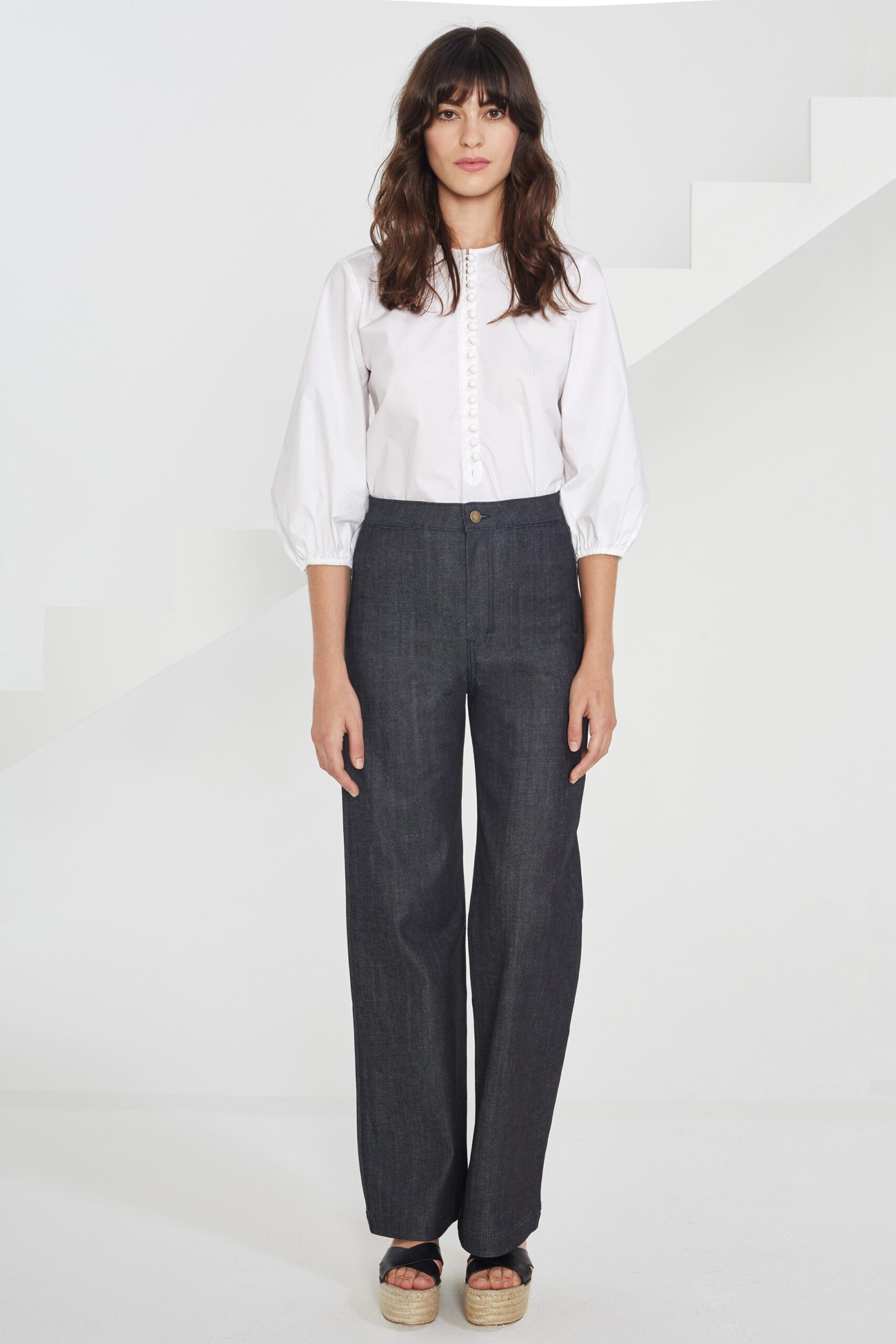 white relaxed shirt with blue pants