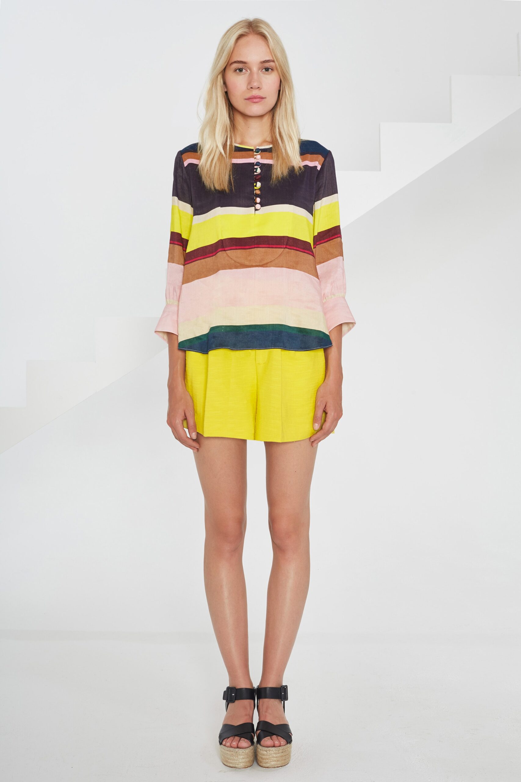 striped top and yellow shorts