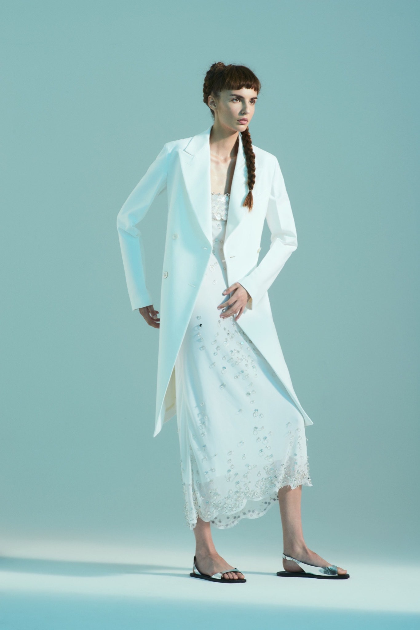 white cotton long-sleeve collared structured buttoned coat
