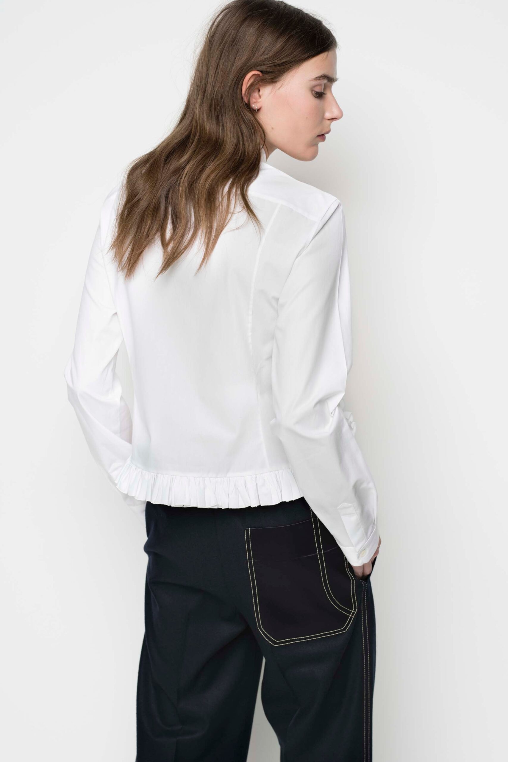 white fitted blouse and black pants