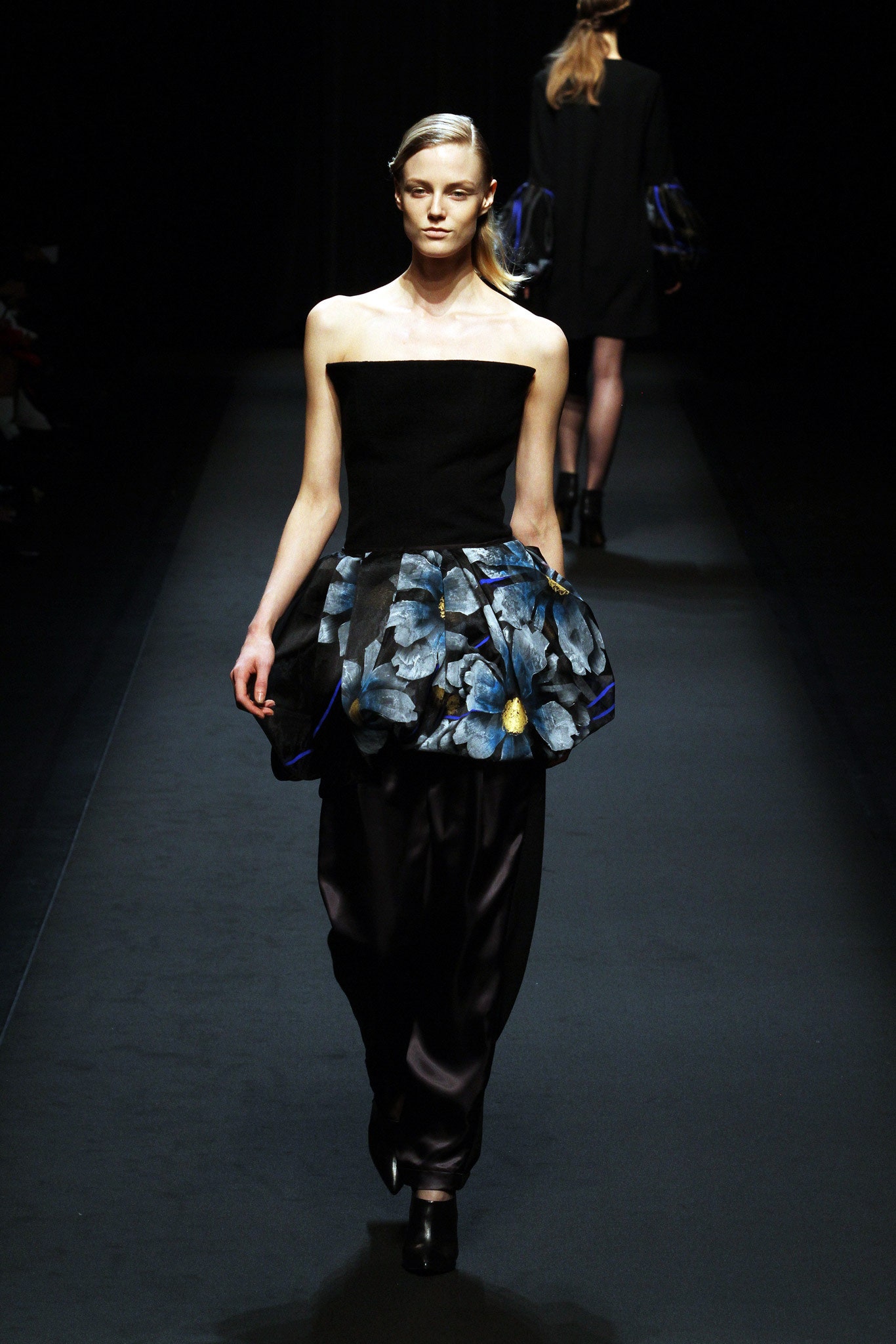 black fitted top with flared skirt