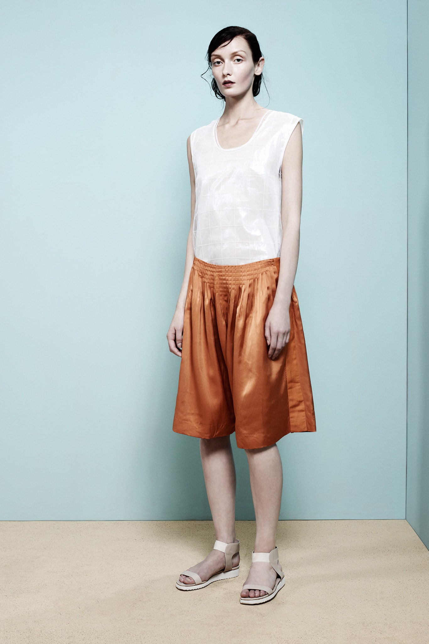 white cotton top with orange shorts