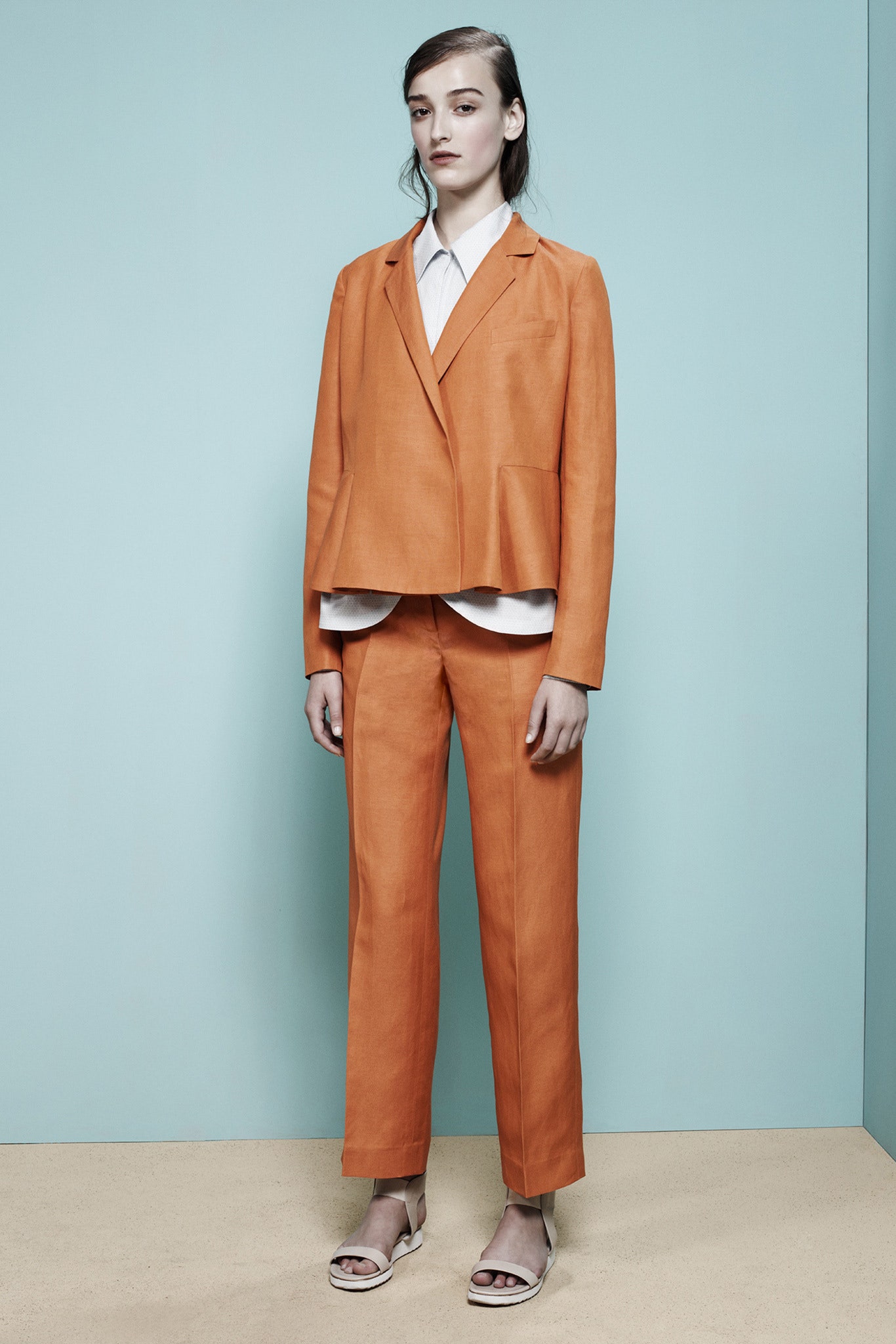 orange tailored suit with white shirt