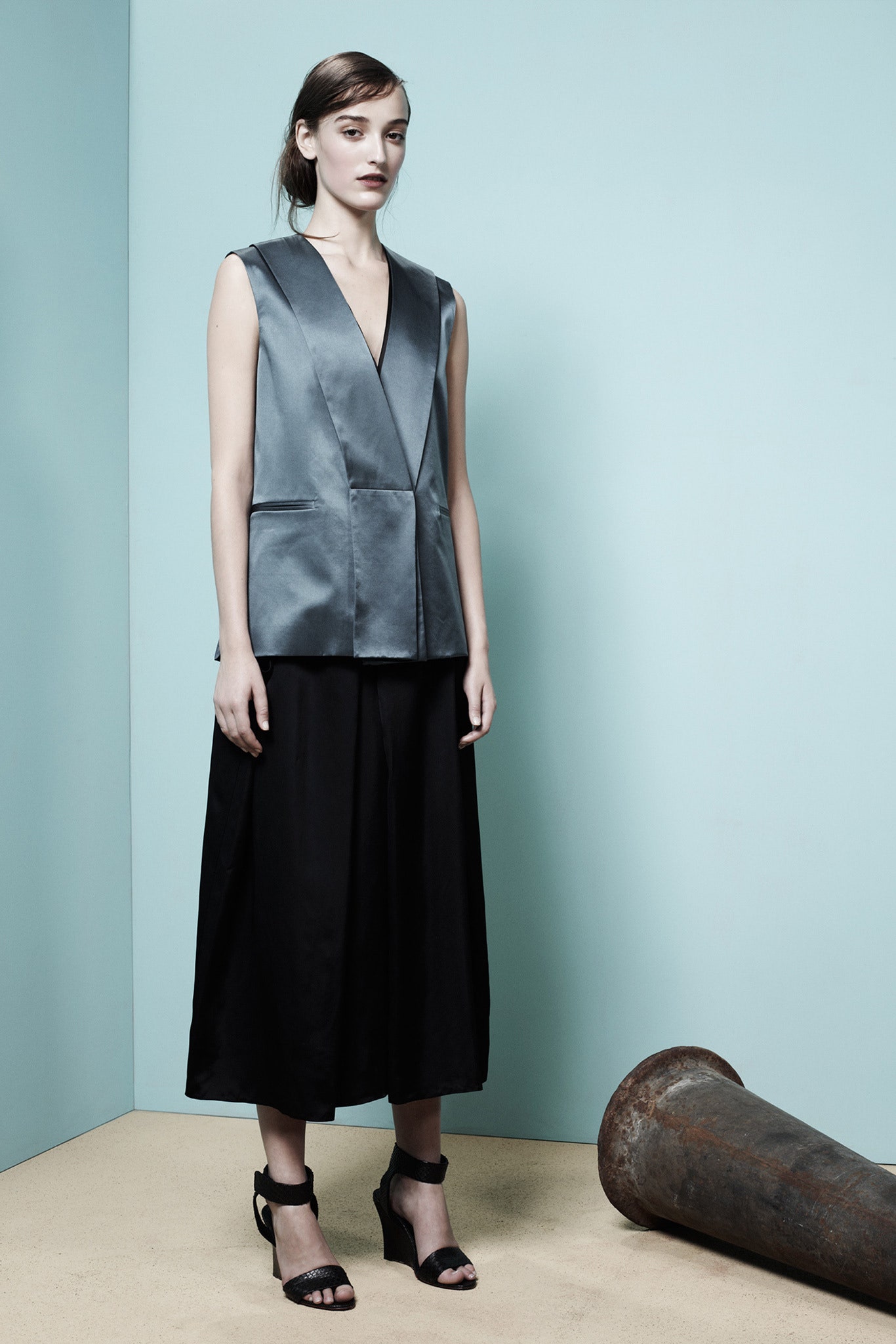 gray silk sleeveless top with black skirt