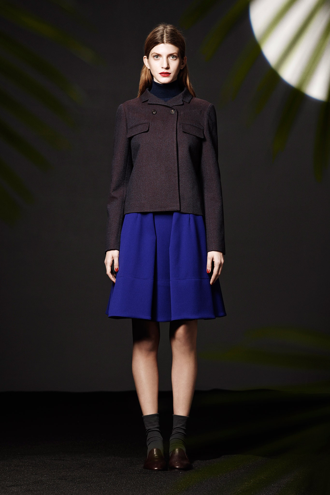 structured black jacket with blue skirt