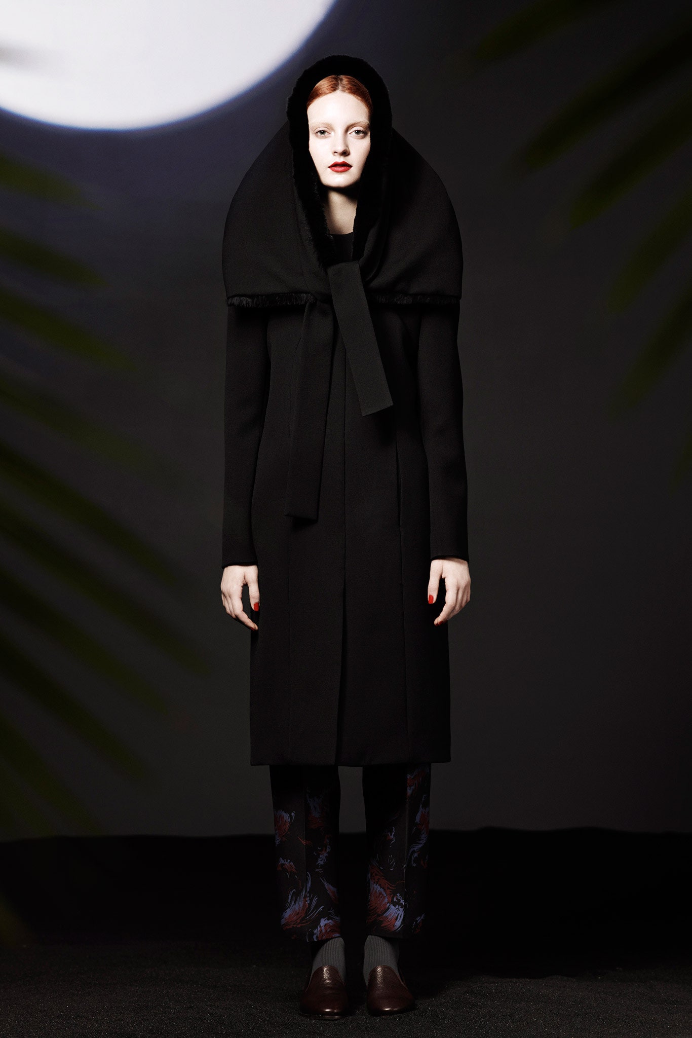 black wool coat with flared pants