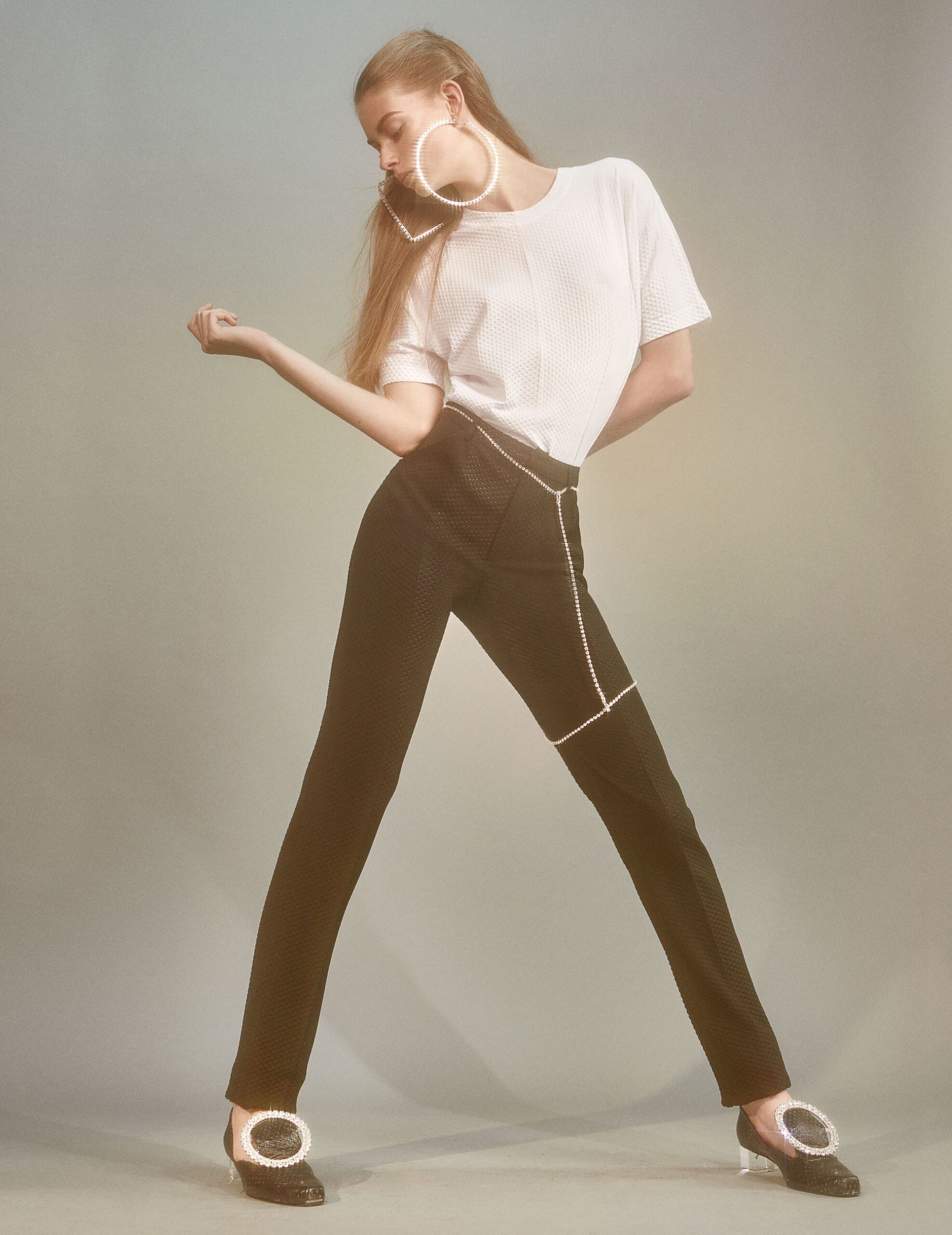 white relaxed top and black fitted pants
