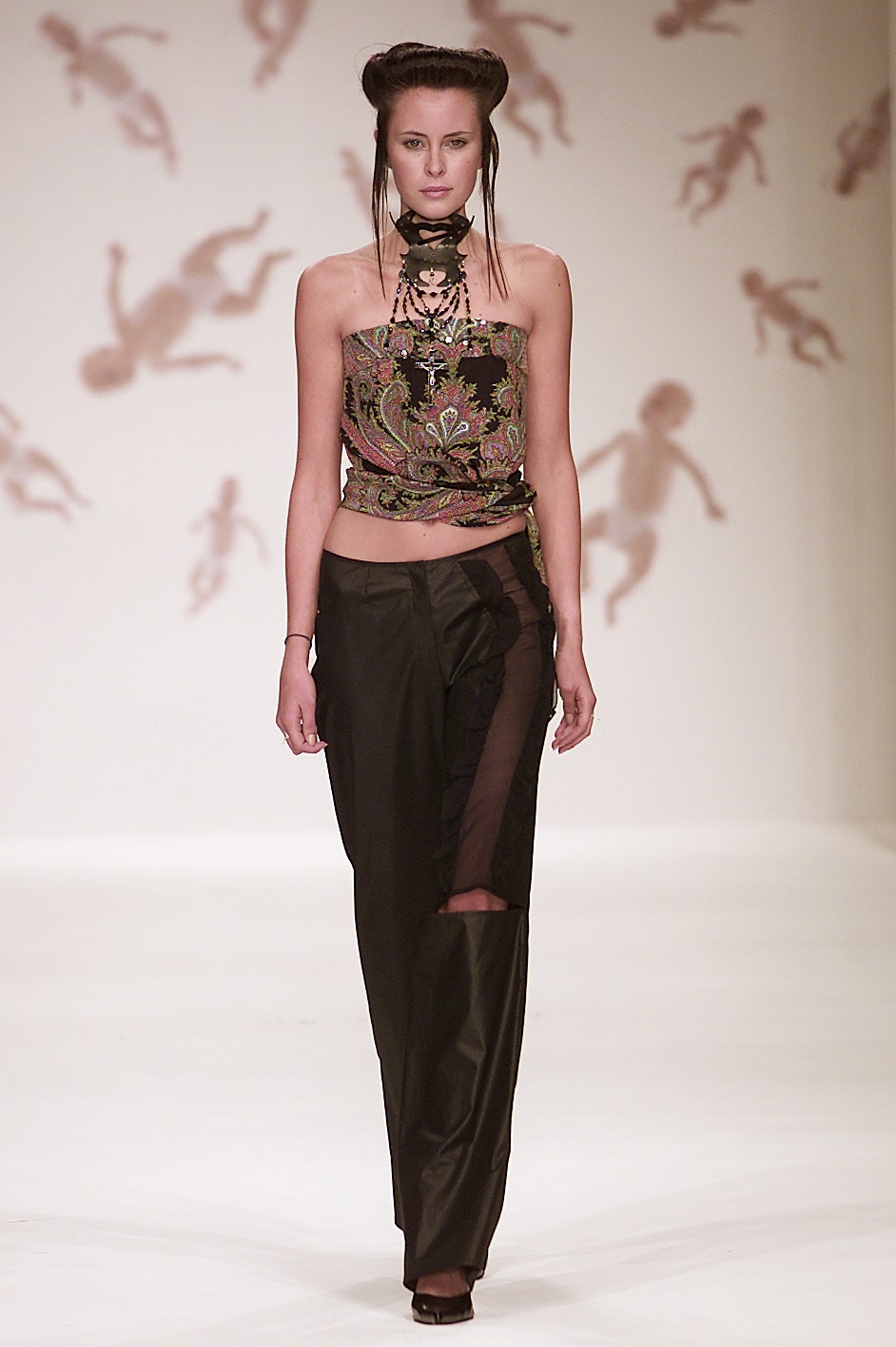 multi-colored fitted top and black pants