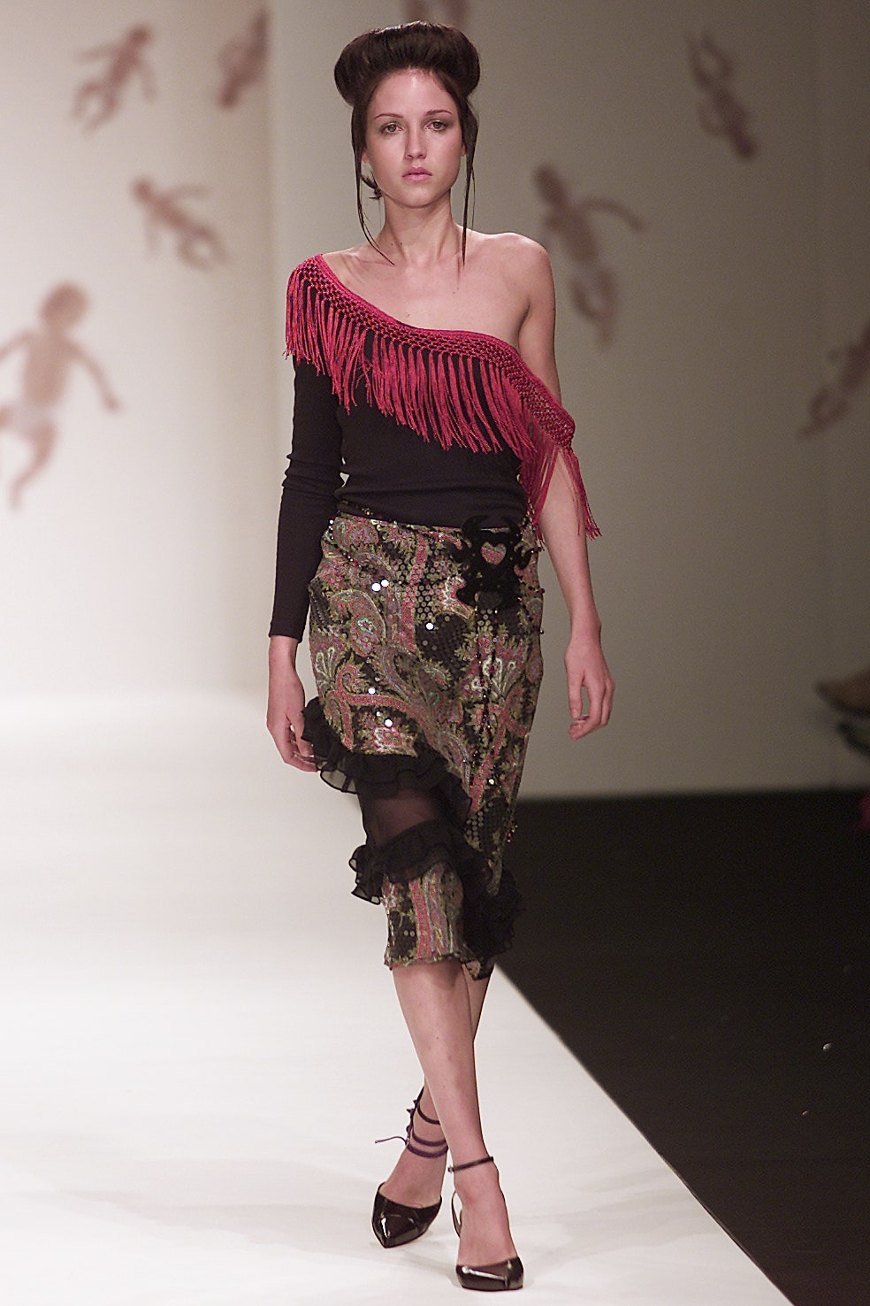 black off-shoulder top with fringed detail