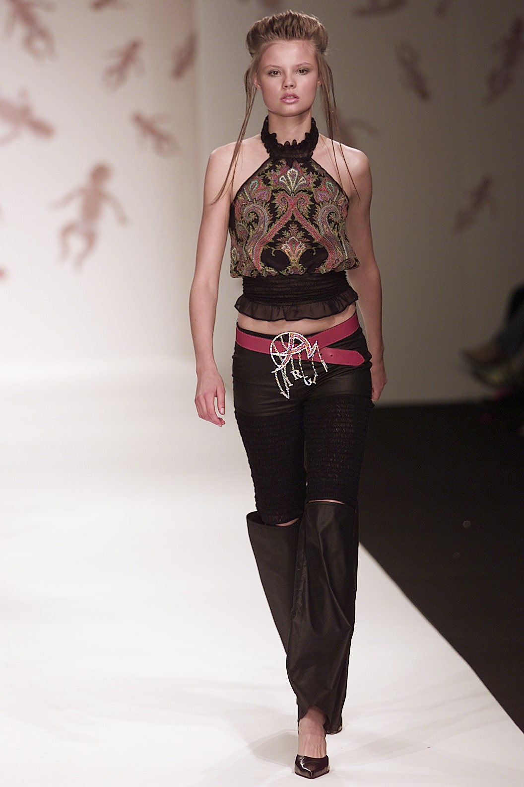 black embroidered sleeveless top and fitted pants