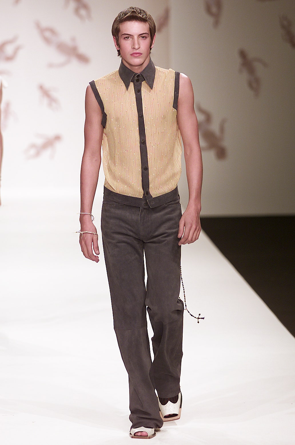 fitted yellow shirt and gray pants