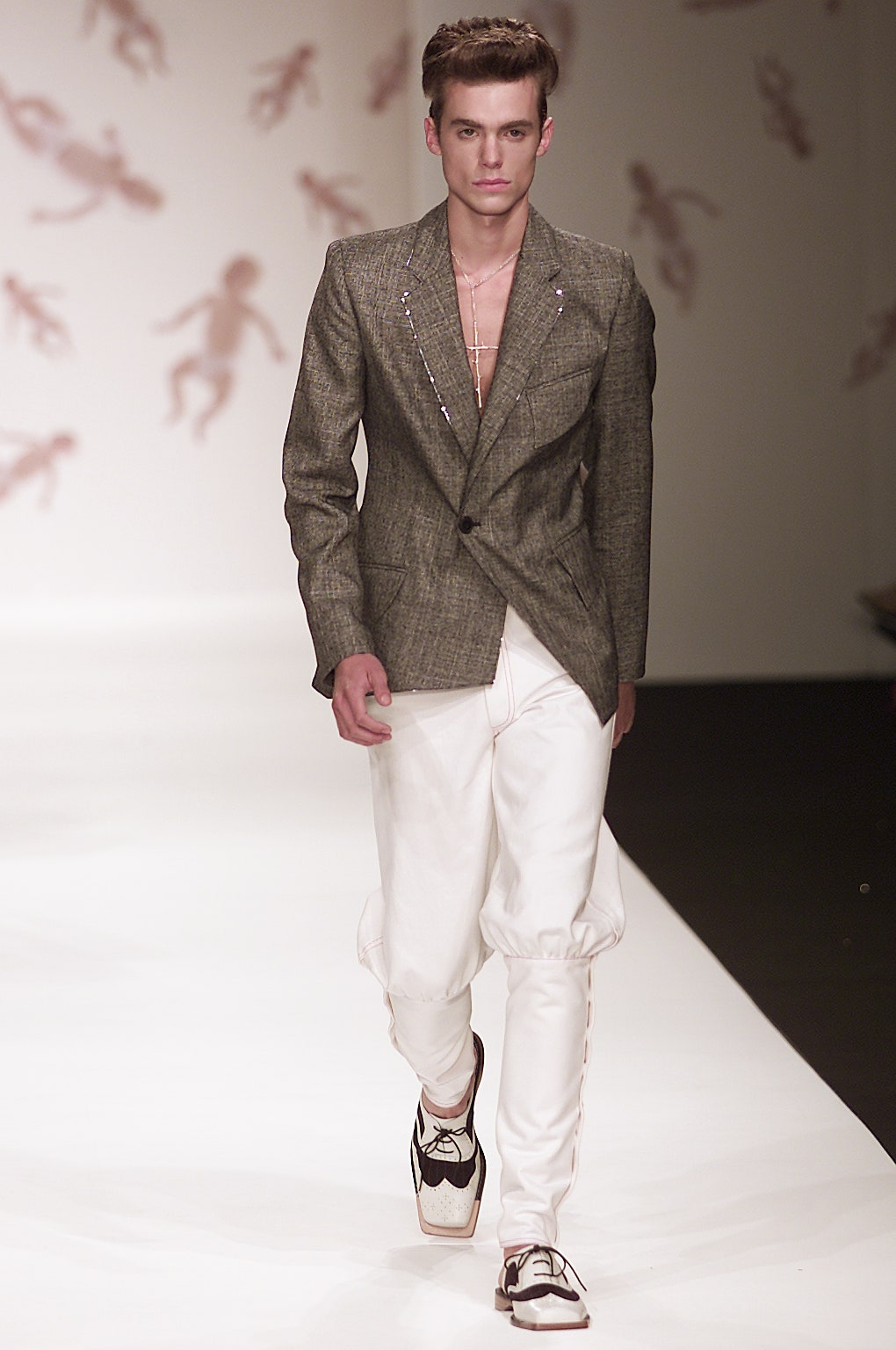 gray tailored blazer with white pants