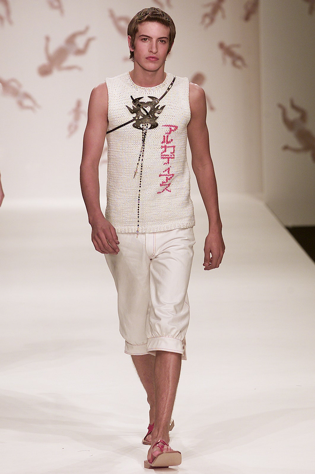 white fitted tank-top and beige shorts