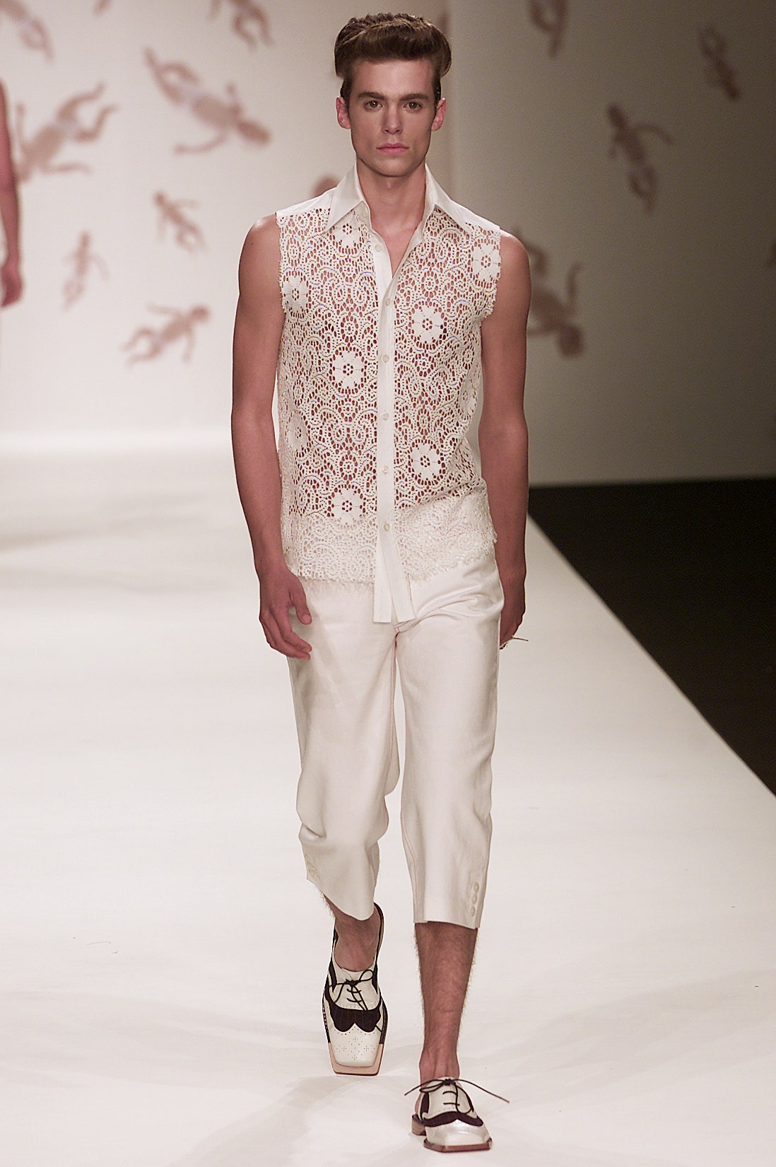 white lace sleeveless shirt with cropped pants