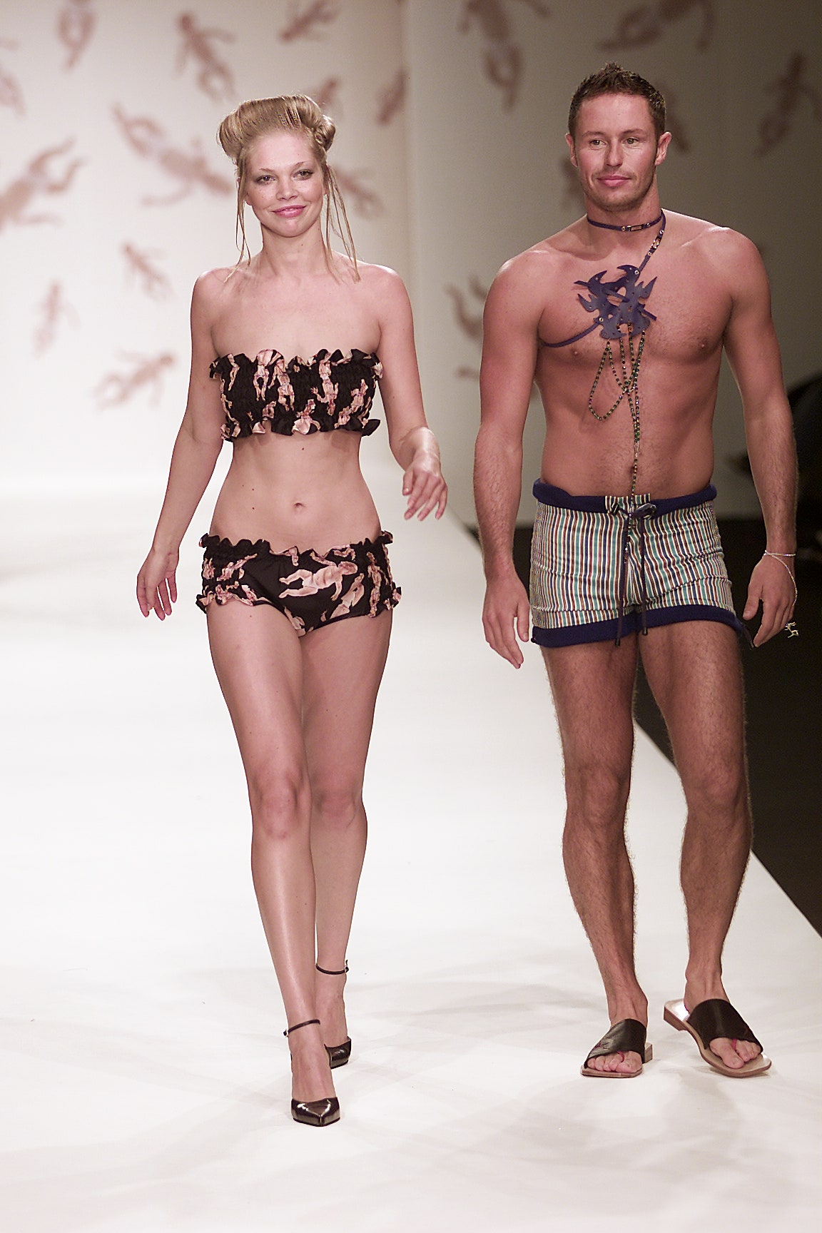 black and pink bikini with blue striped shorts