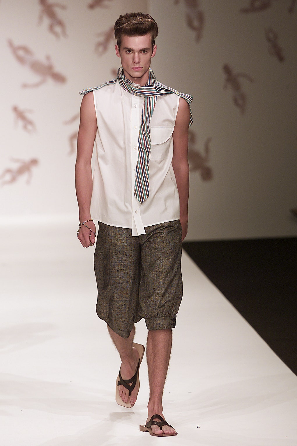 white sleeveless shirt with brown shorts