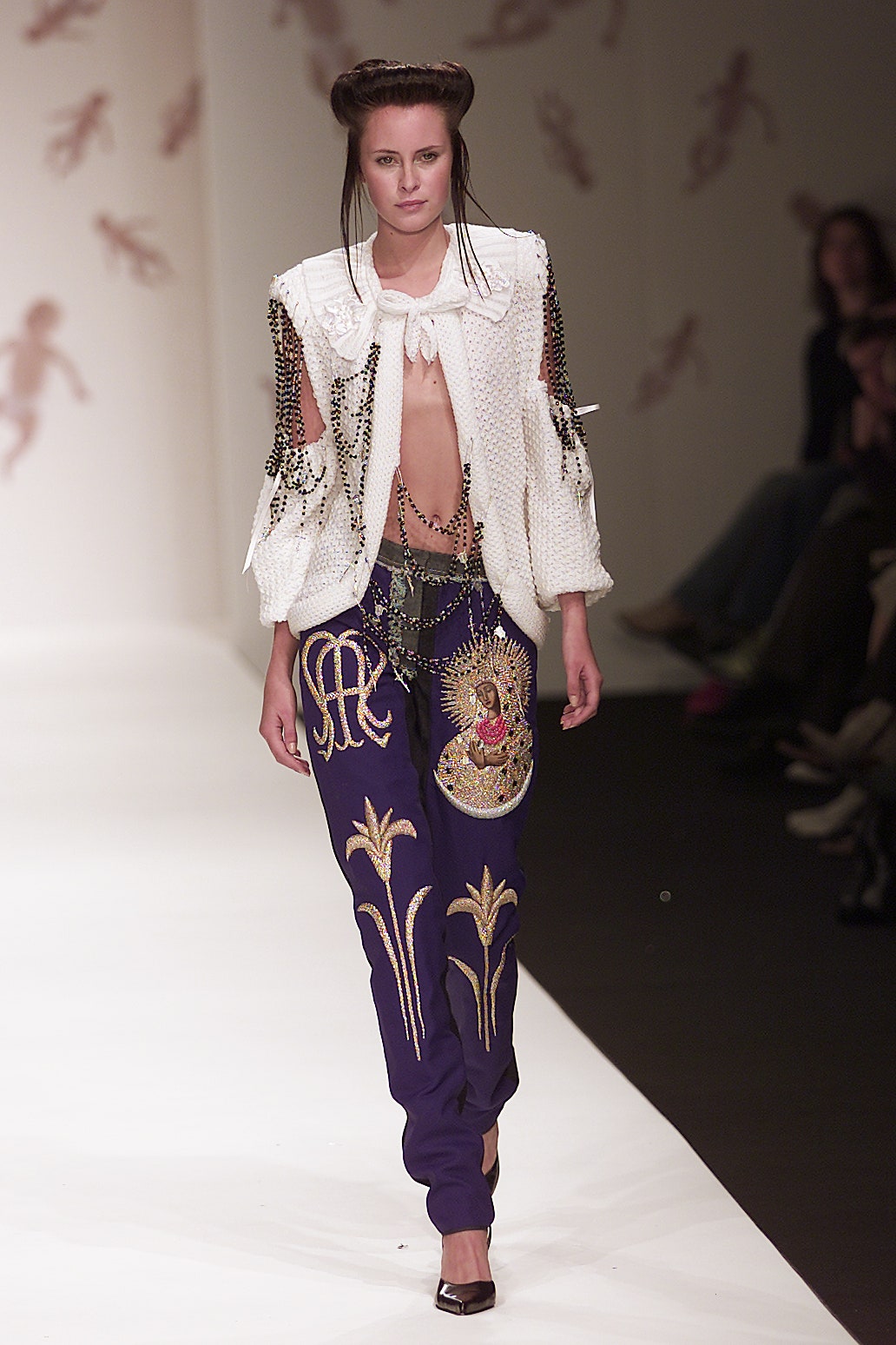 white embroidered jacket with purple pants