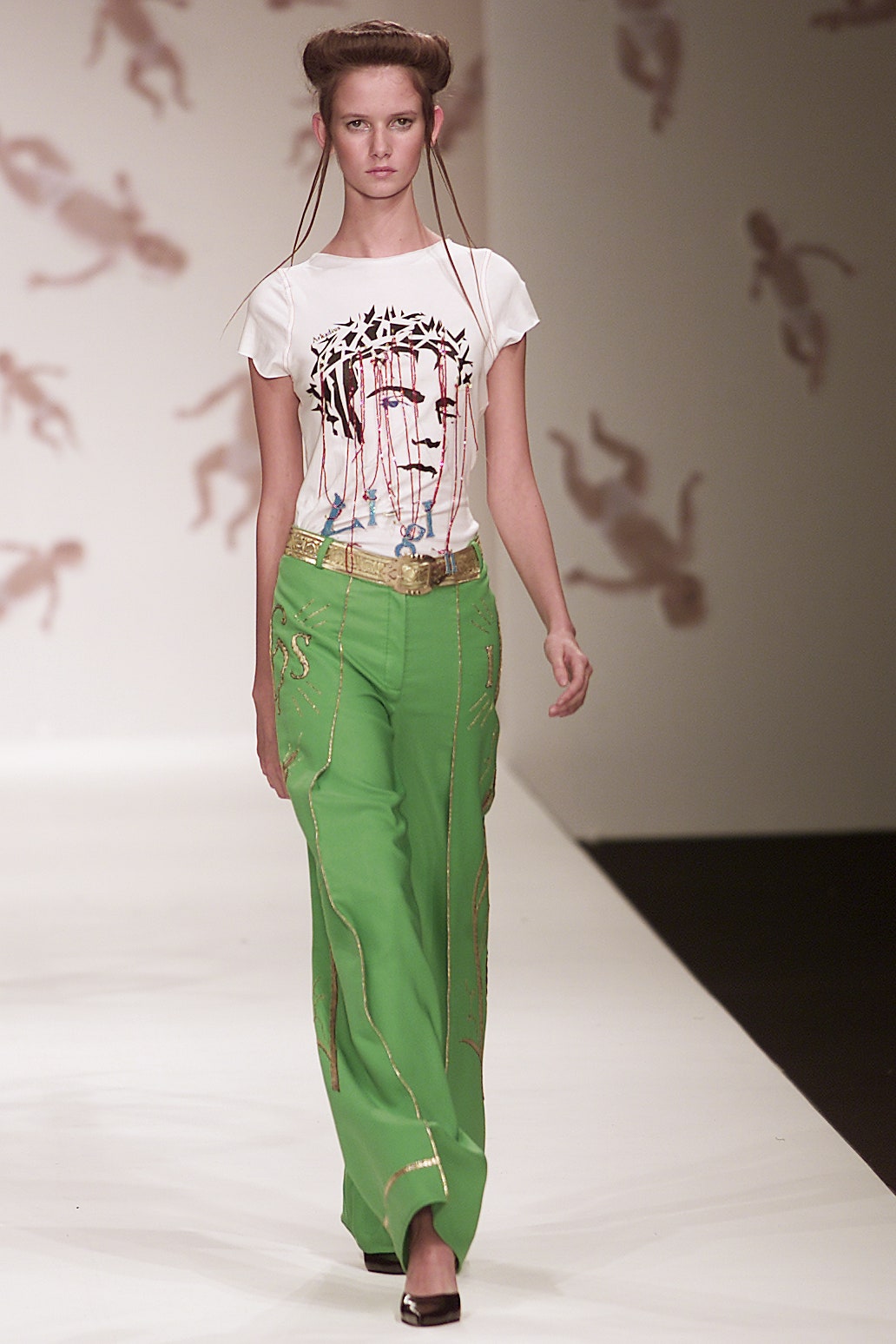 white printed t-shirt and green pants