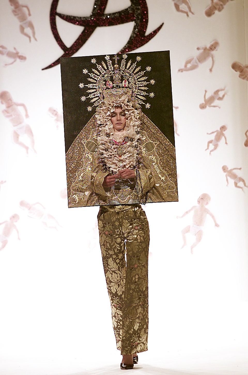 gold silk flared pants and embroidered top