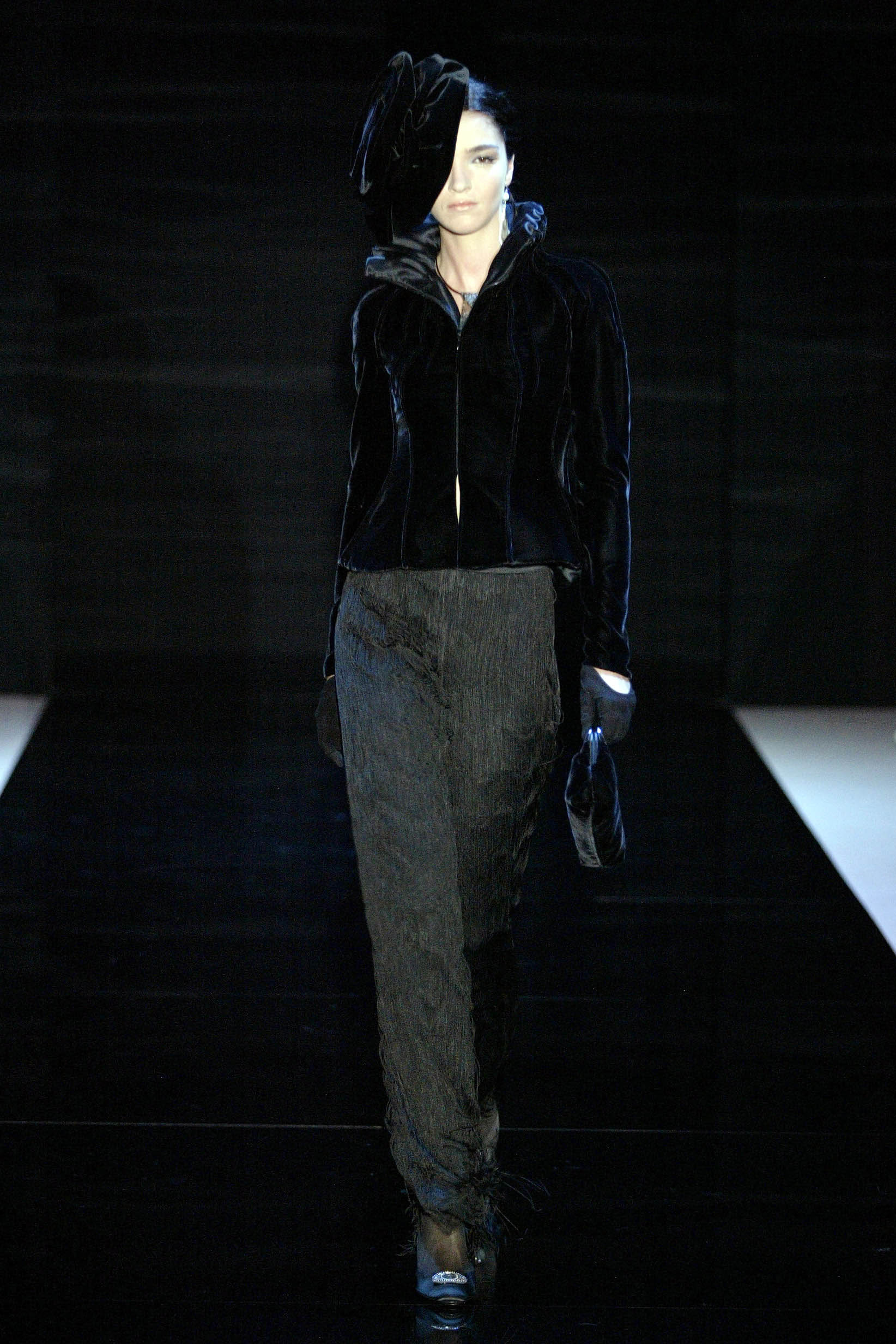 black velvet fitted jacket and pleated pants