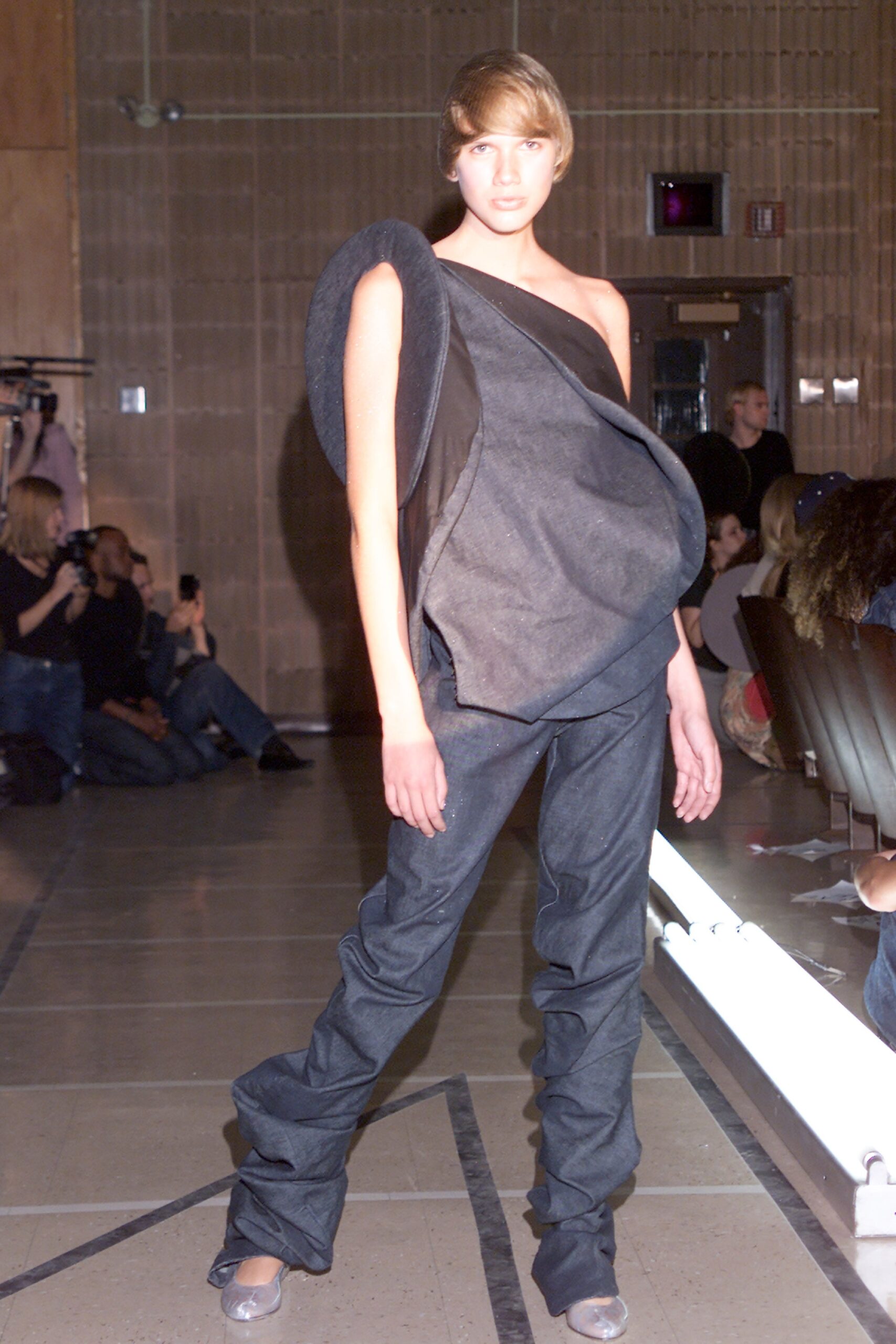 black asymmetric top with denim pants