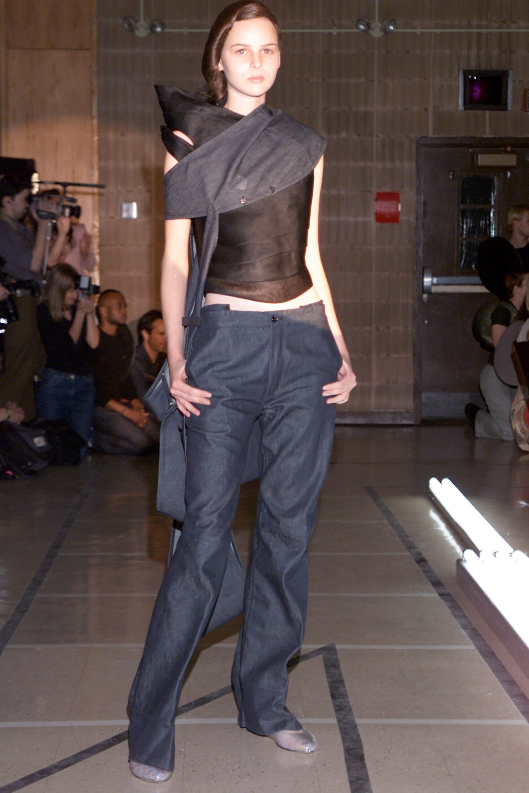 black leather asymmetric top with denim pants