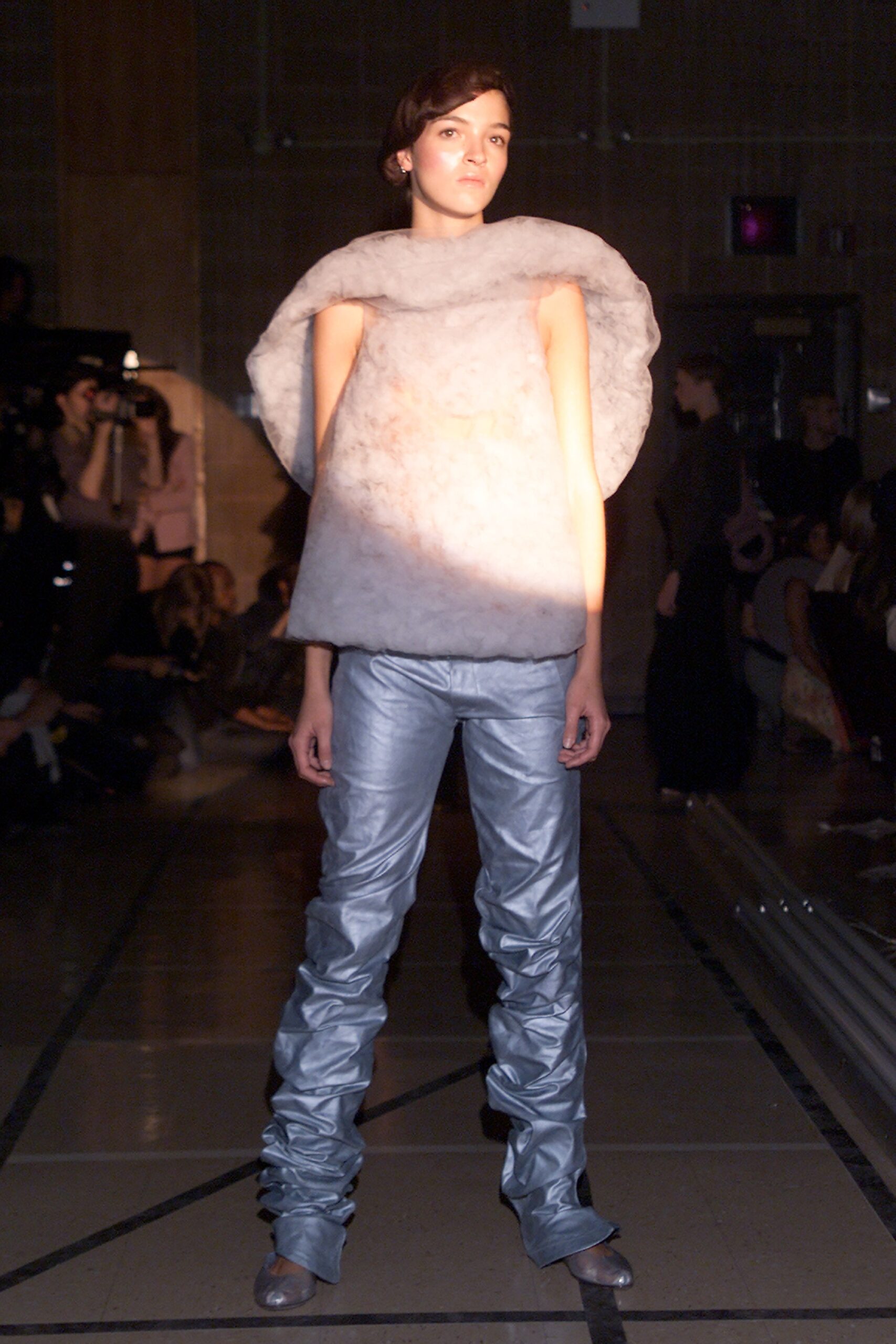 white fur sleeveless top and blue pants